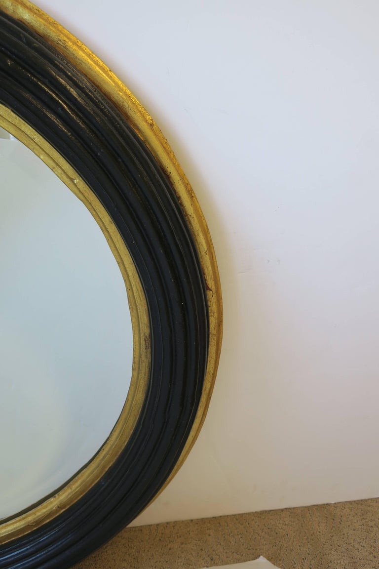 Midcentury Round Black and Gold Beveled Wall Mirror at 1stDibs