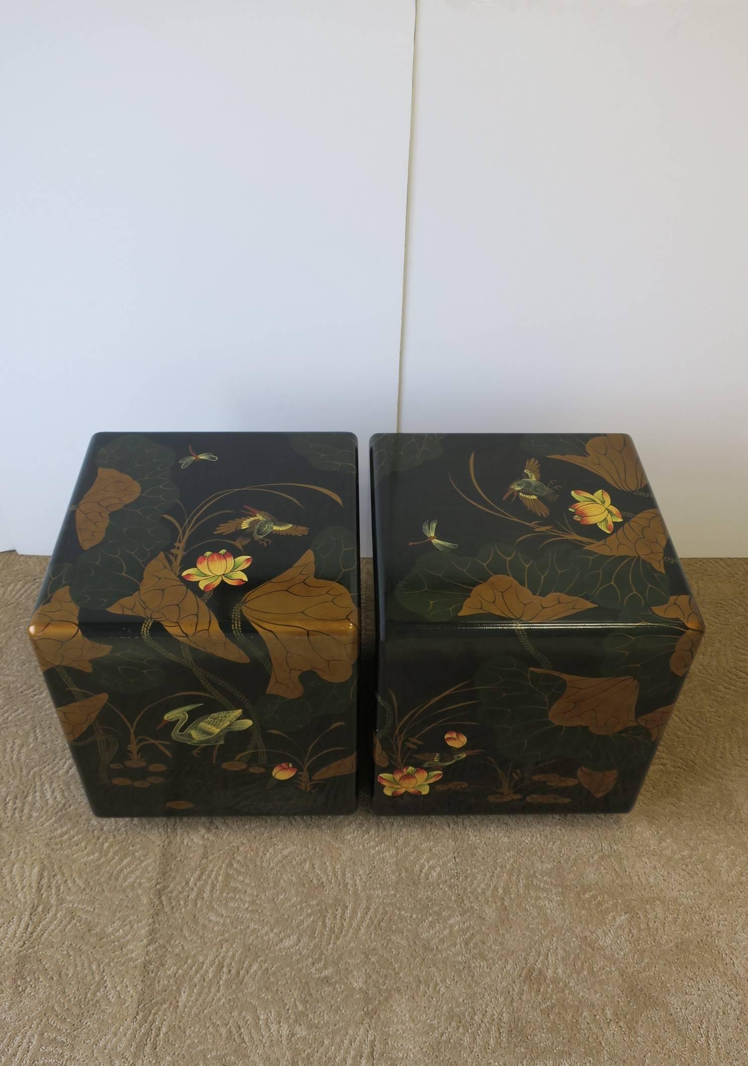 A beautiful pair of vintage Modern style black lacquer side or end table - or together as a coffee/cocktail table. Tables feature detailed birds, lotus flower and leaf design. Rounded corners and edges. Colors include: tables predominantly feature