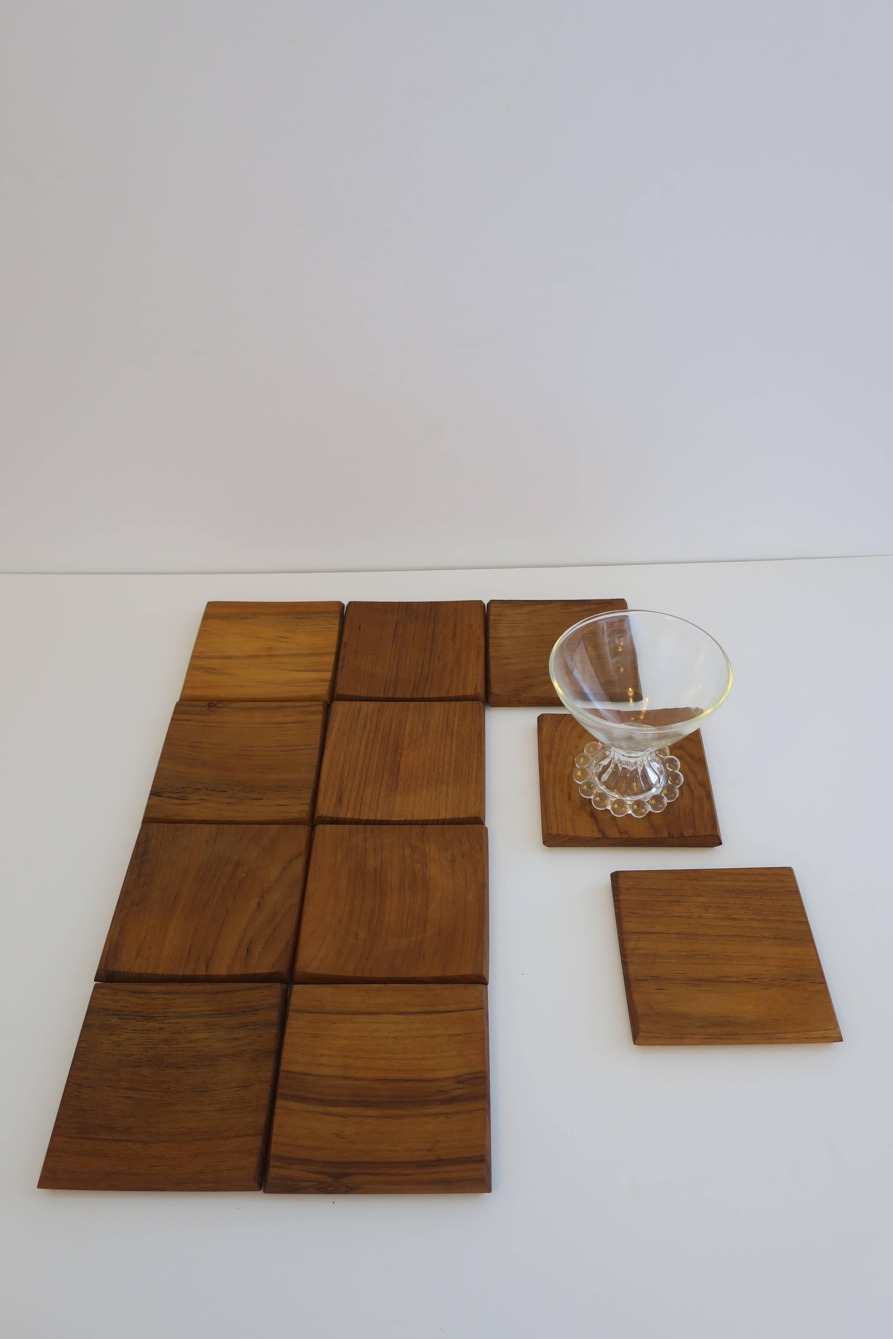 A beautiful set of 5 Scandinavian Modern teak coasters from Denmark. Dansk, made in Denmark as show in image #8 and #9. Two sets of 5 available. 

Each coaster measures: 3.75 in. square. 

Set available here online. By request, set can be made