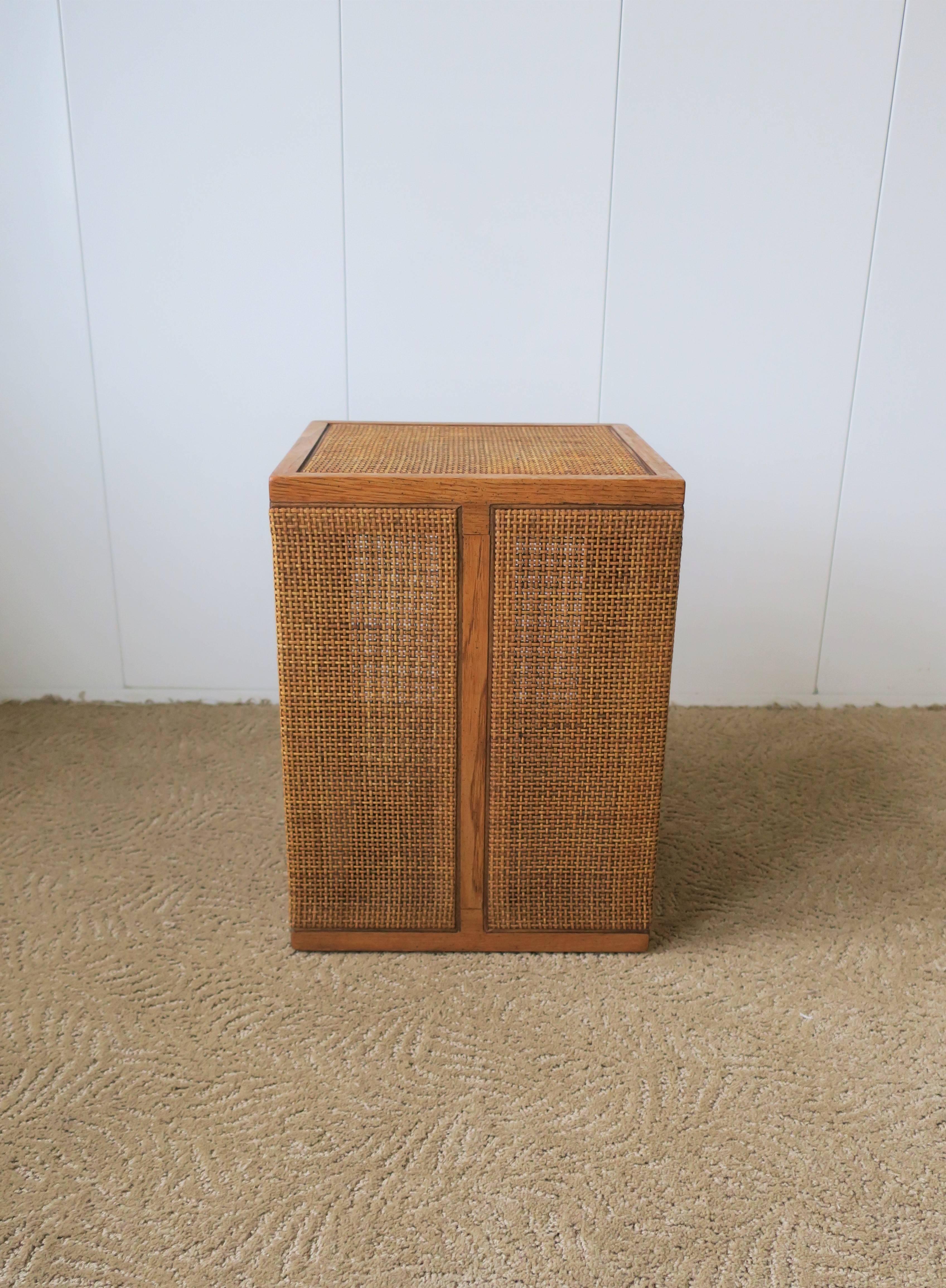 A beautiful small vintage square weaved rattan side or end table. Tabletop is reinforced underneath offering a stable environment for a drink, etc. 

Table measures: 12 in. x 12 in. x 16 in. H

Item available here online. By request, item can be