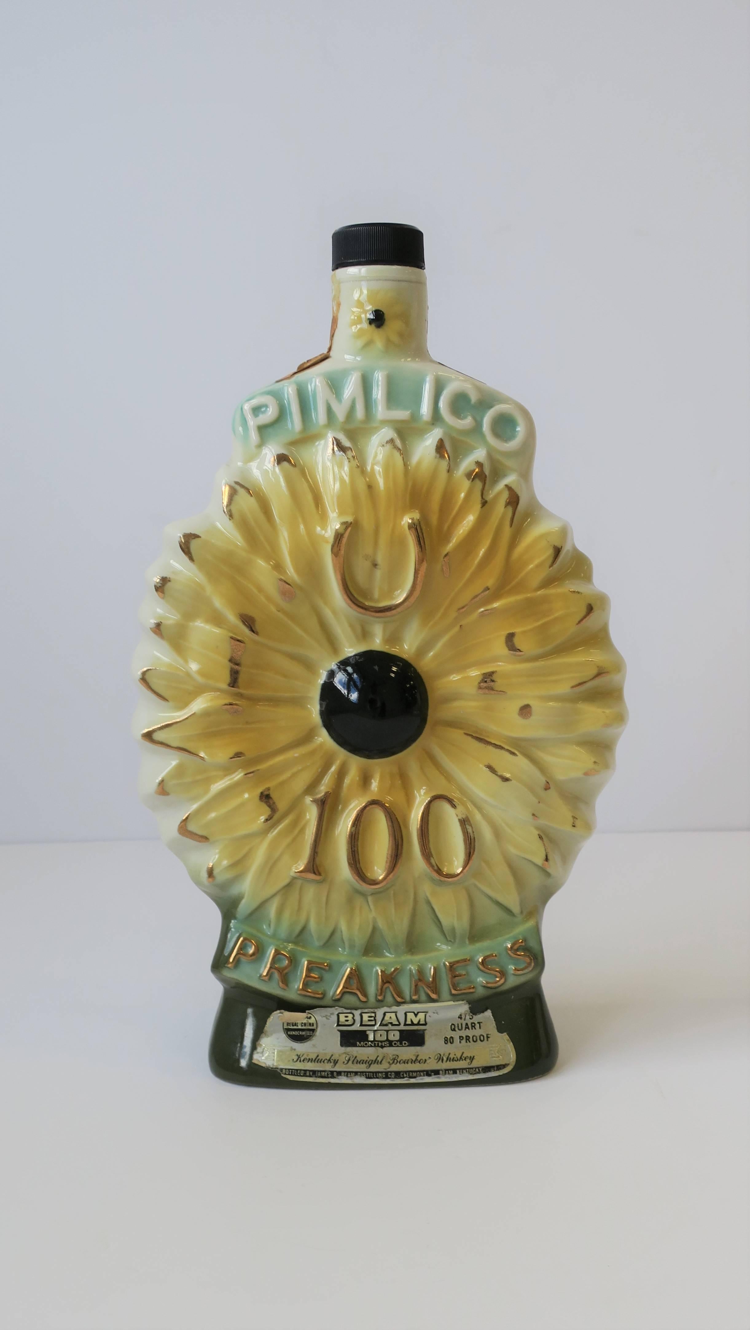 A vintage 100th Anniversary Preakness Stakes Kentucky Derby decanter liquor or spirits bottle by James B. Beam Distilling Co., circa 1975. Bottle commemorates the 100th Anniversary of the Preakness Stakes thoroughbred horse race at Pimlico