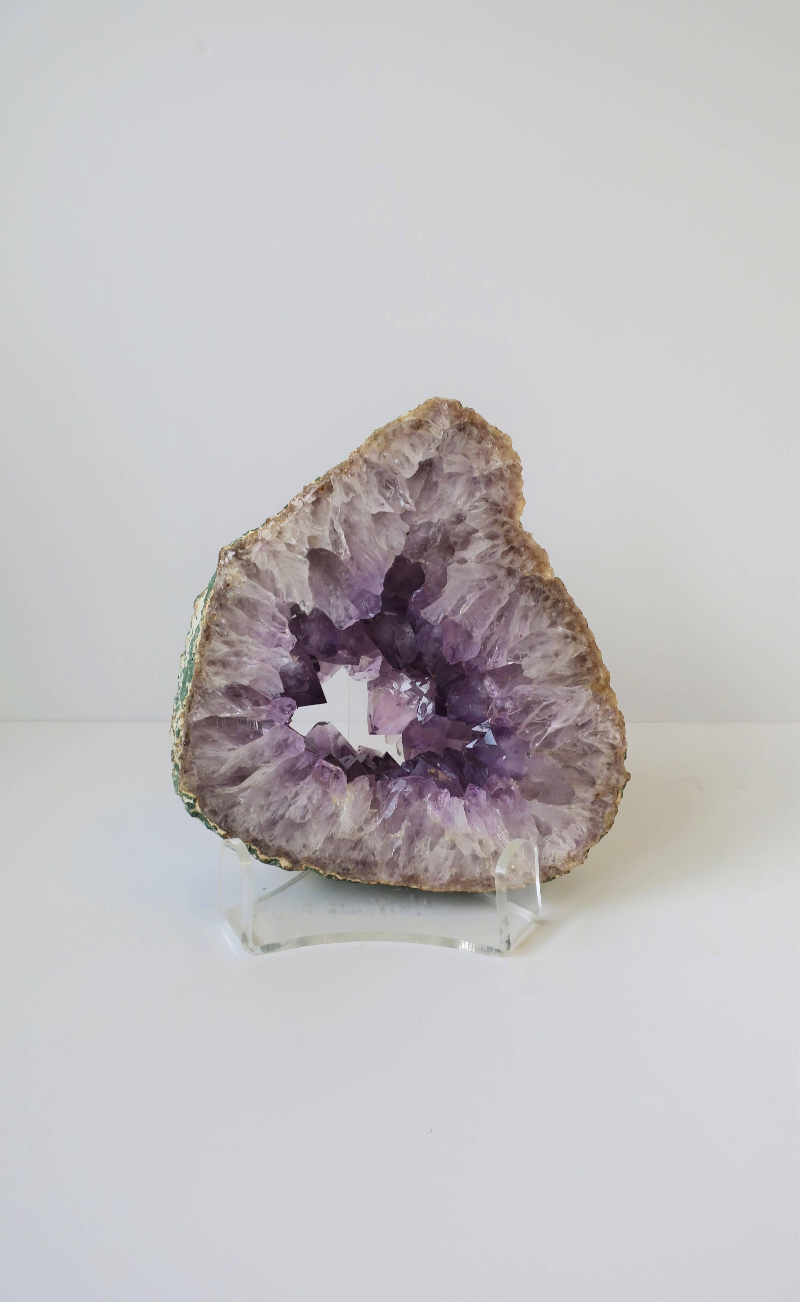 A beautiful and relatively large natural purple amethyst crystal sculpture. Acrylic base included. 

Piece measures: 
2.75 in. thick 
Approximately 8.5 in. - 9 in. in diameter

Item available here online. By request, item can be made available by