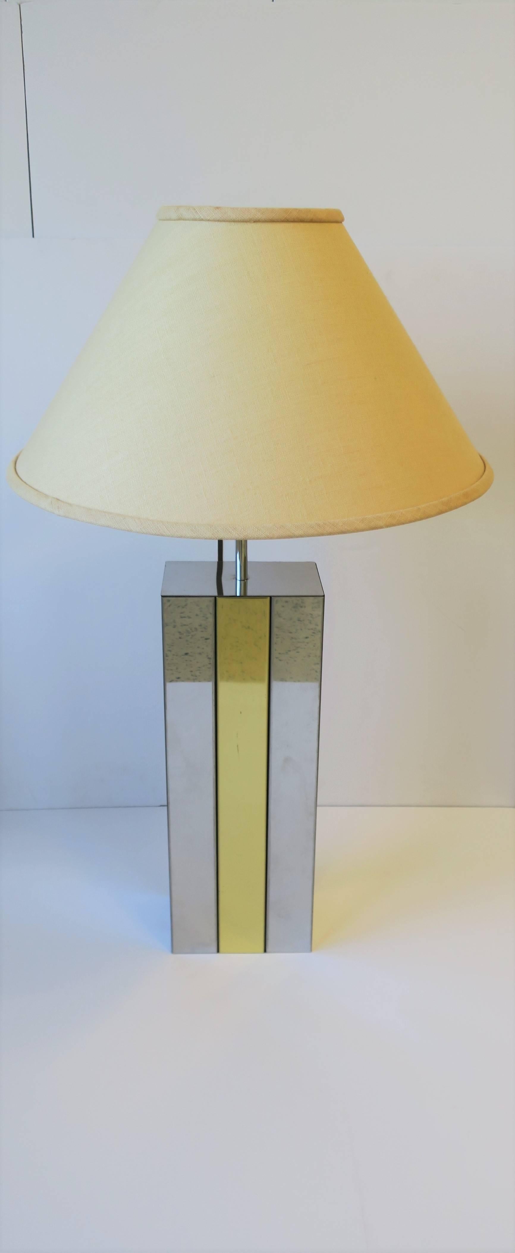 A '70s Modern Robert Sonneman designed rectangular chrome and brass desk or table lamp, circa 1970s. Chrome with brass stripe down front and back; lamp is marked 'Sonneman' on lower back as shown in last image. In fine working order. 

Lamp