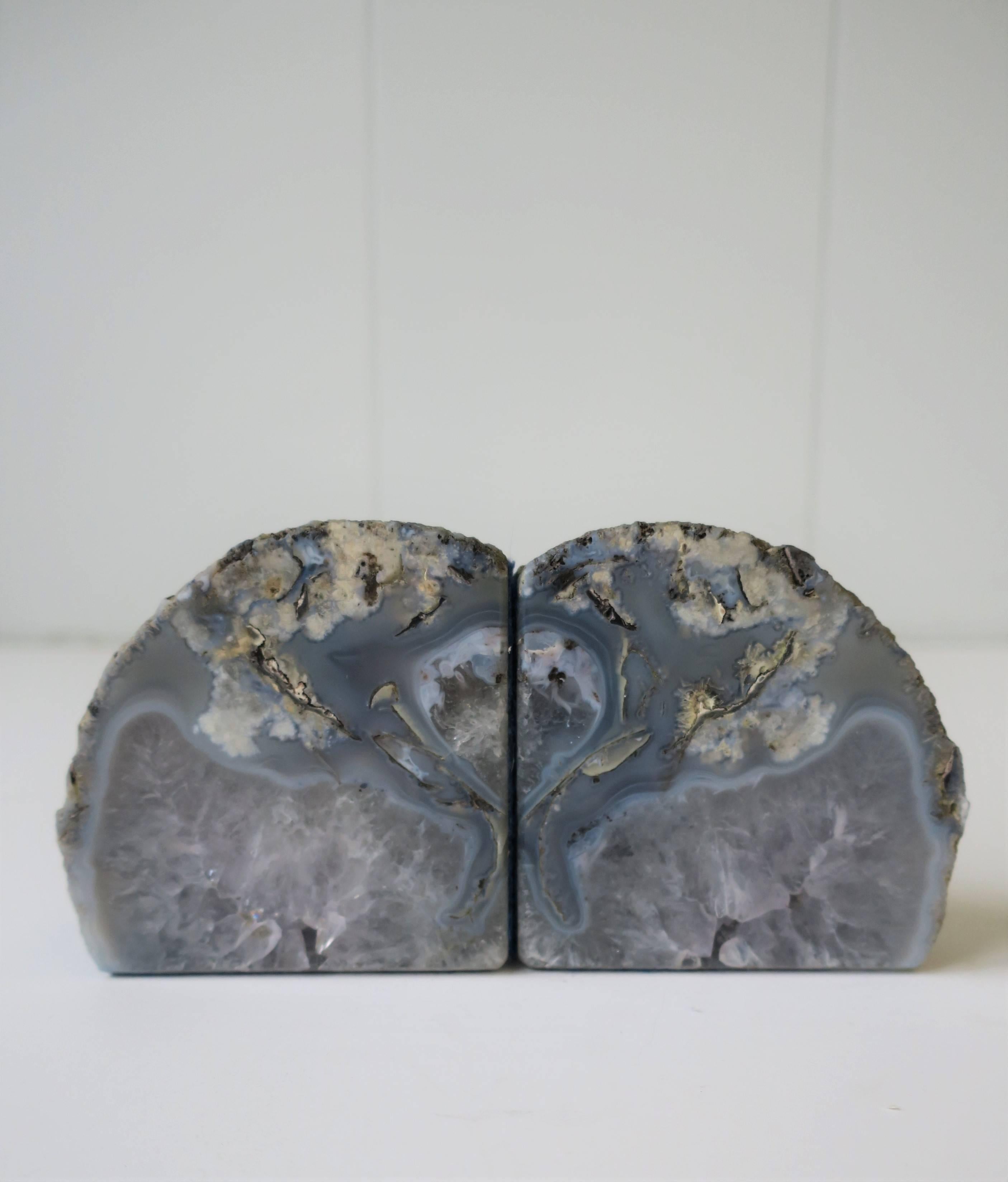 A beautiful pair of blue and white natural agate/rock crystal bookends or decorative objects. These agate/rock crystals work well on a bookshelf or equally well as stand alone objects as show in images 4 and 5. Protective blue felt bottom on two