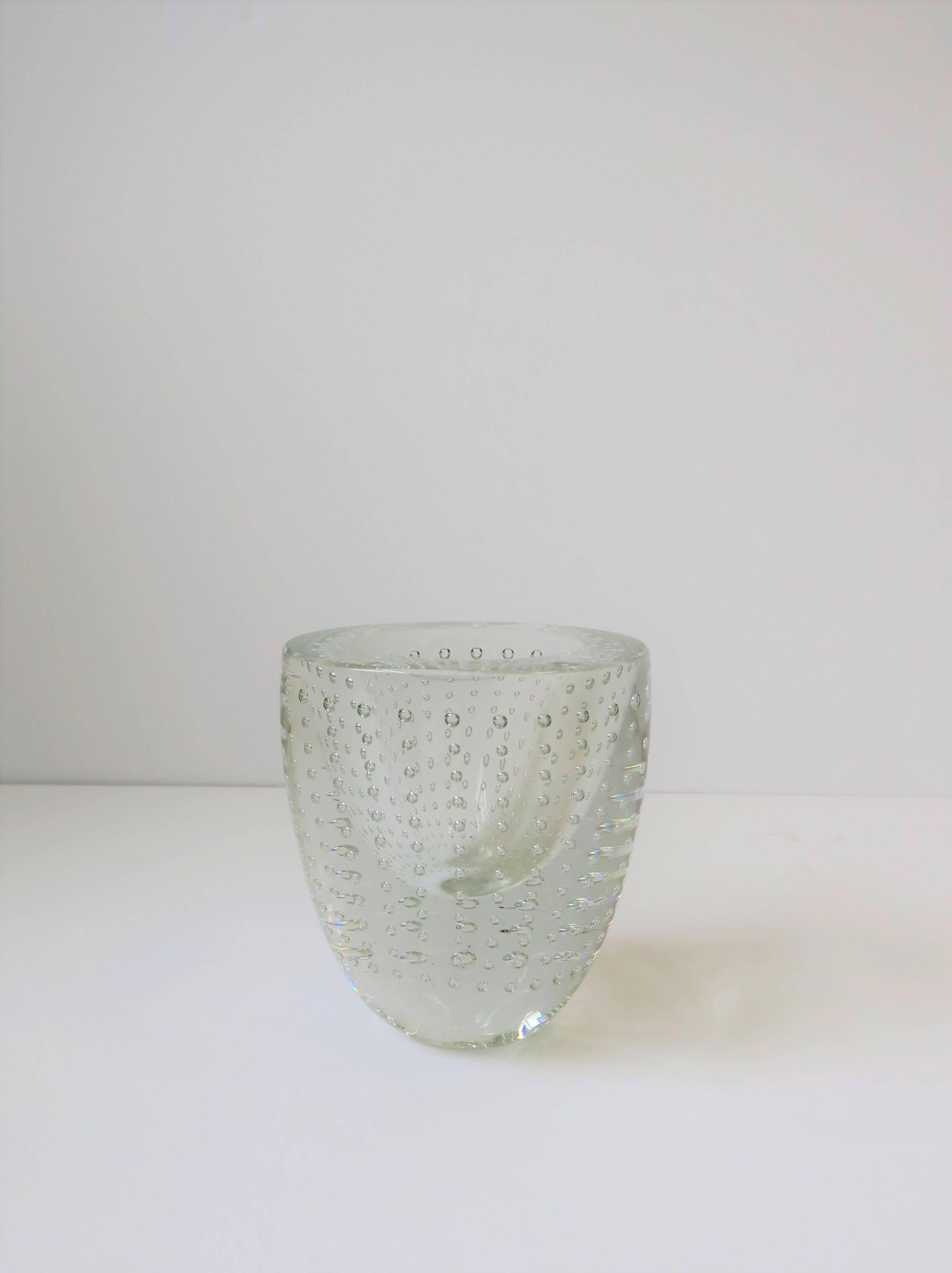 A beautiful and substantial clear studio art glass vase with a controlled bubble design, by artist and sculptor Leon Applebaum. Beautiful with or without flowers. Signed on bottom as show in image #10. Vase thickness almost 1