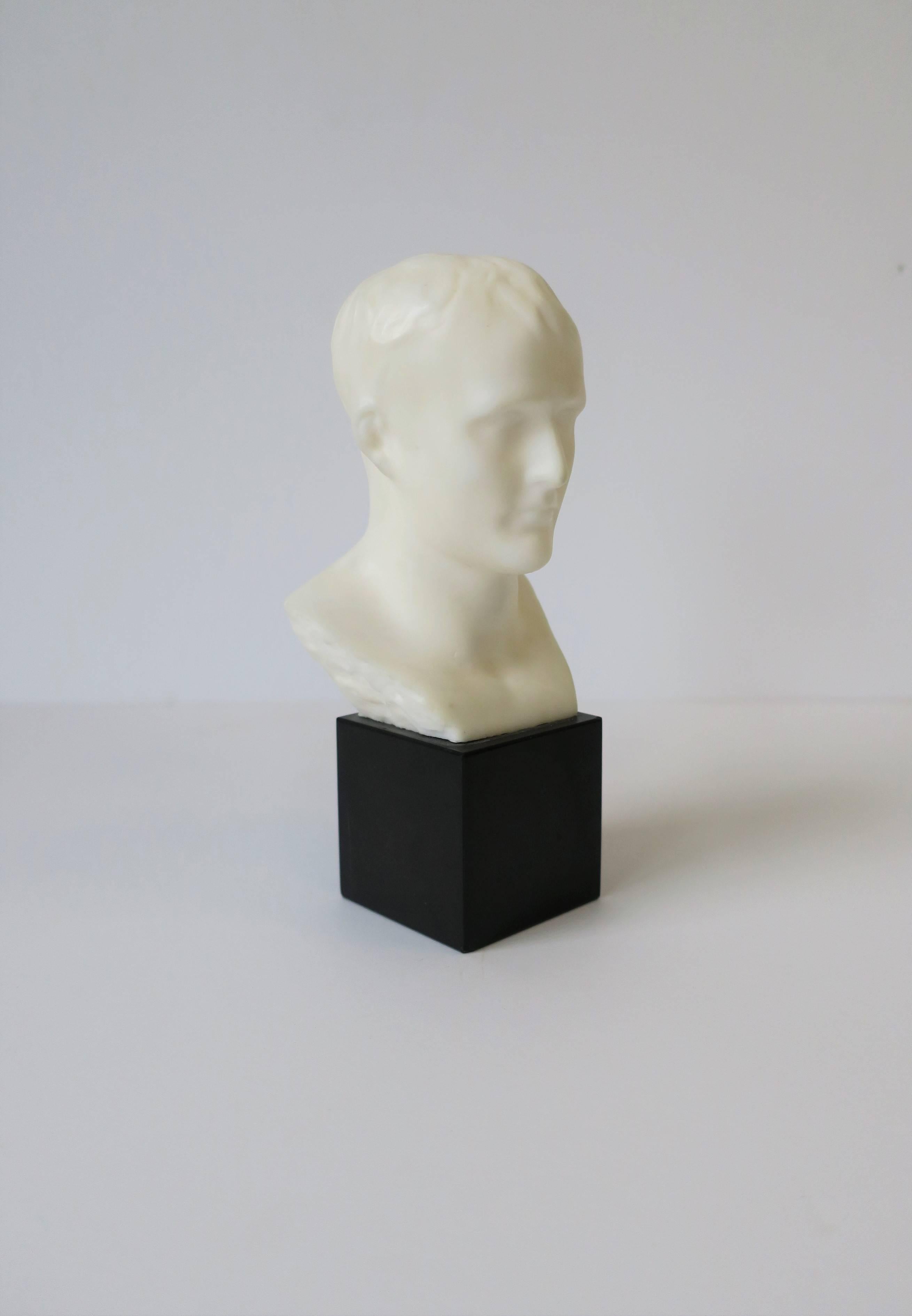 A vintage white resin male bust sculpture on a square black marble base. 

Sculpture measures: 2.5