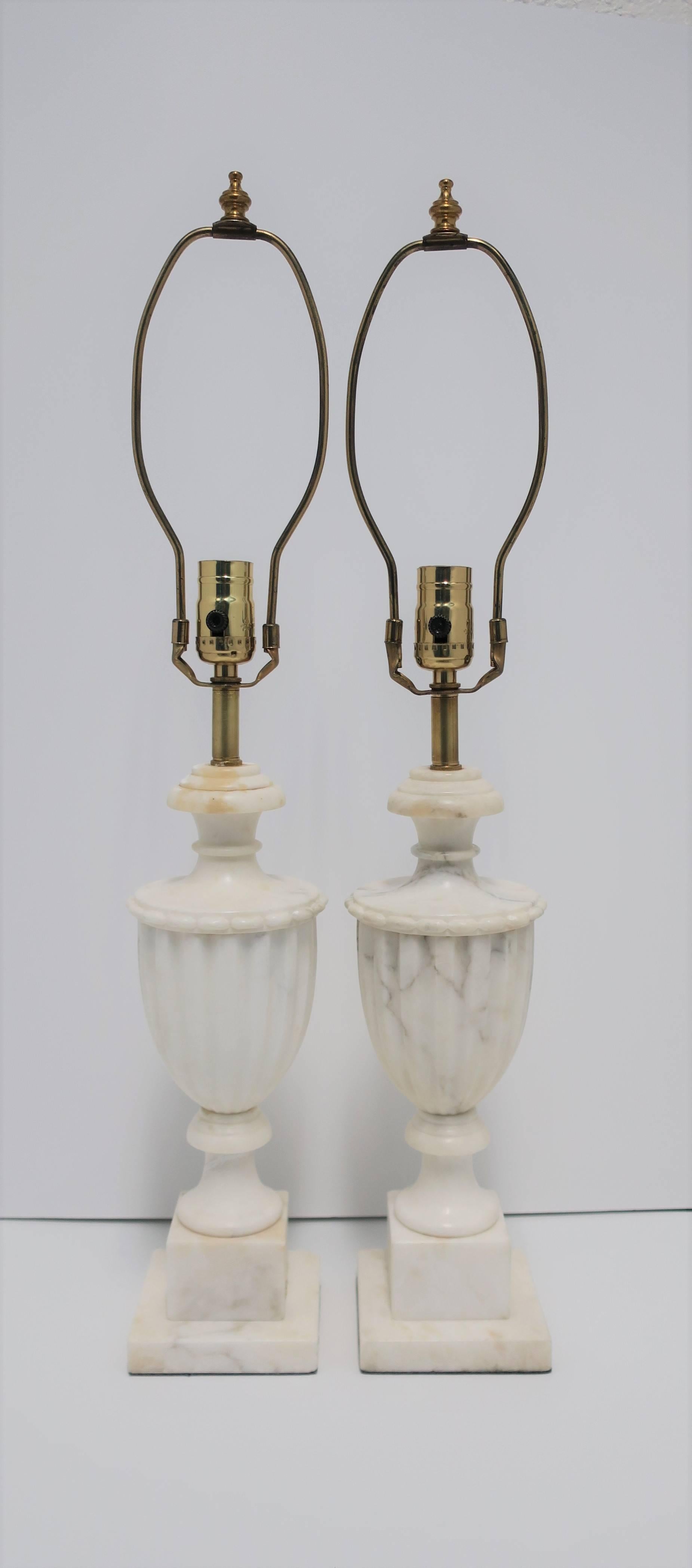 Pair/Set Available Here for $1800

Beautiful pair of early 20th century Italian Classical Roman style white marble urn form table lamps, Italy. Pair feature a carved urn form with beautiful details, made predominantly white marble with traces of