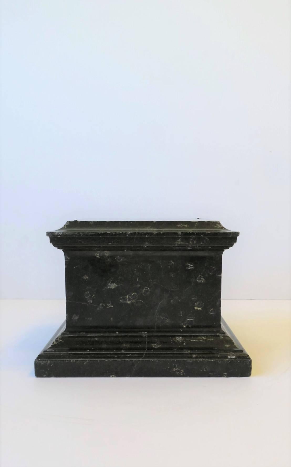 A substantial black marble or stone pedestal column or plinth base, circa late 19th century. Piece would work well for a sculpture, bust, or to display art, jewelry, etc. 

Measurements:
Overall piece measures: 9.13