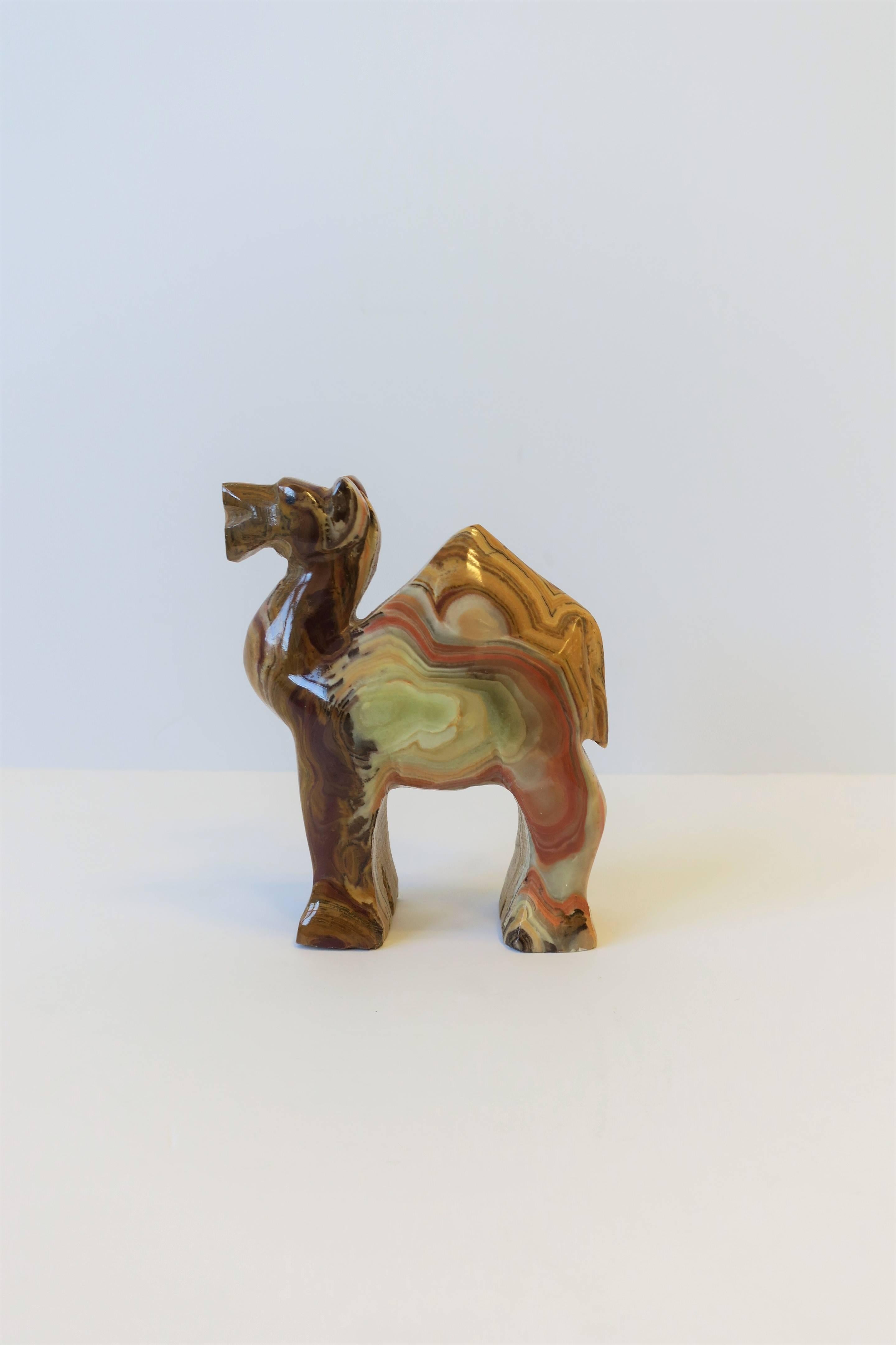 A beautiful vintage onyx marble Camel animal sculpture, circa 1970s. Colors include brown, caramel, cream, green, and pink. Dimensions: 4.5