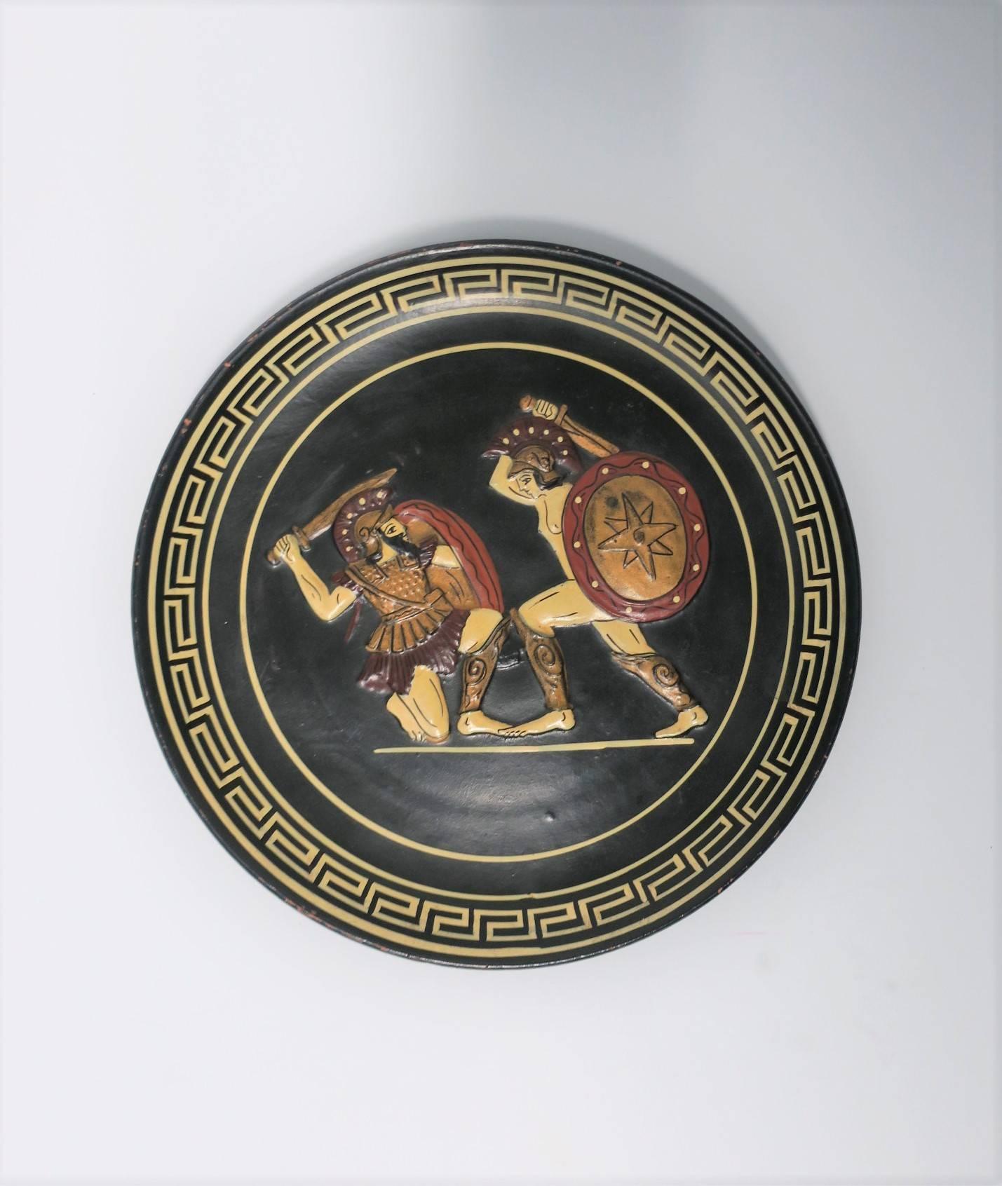 A vintage Greek wall or decorative plate with raised relief scene depicting Achilles fighting against Hector. Handmade in Greece, and numbered as No. 502, as marked on back.

Plate measures: .75 in. H x 8.25 in. Diameter

