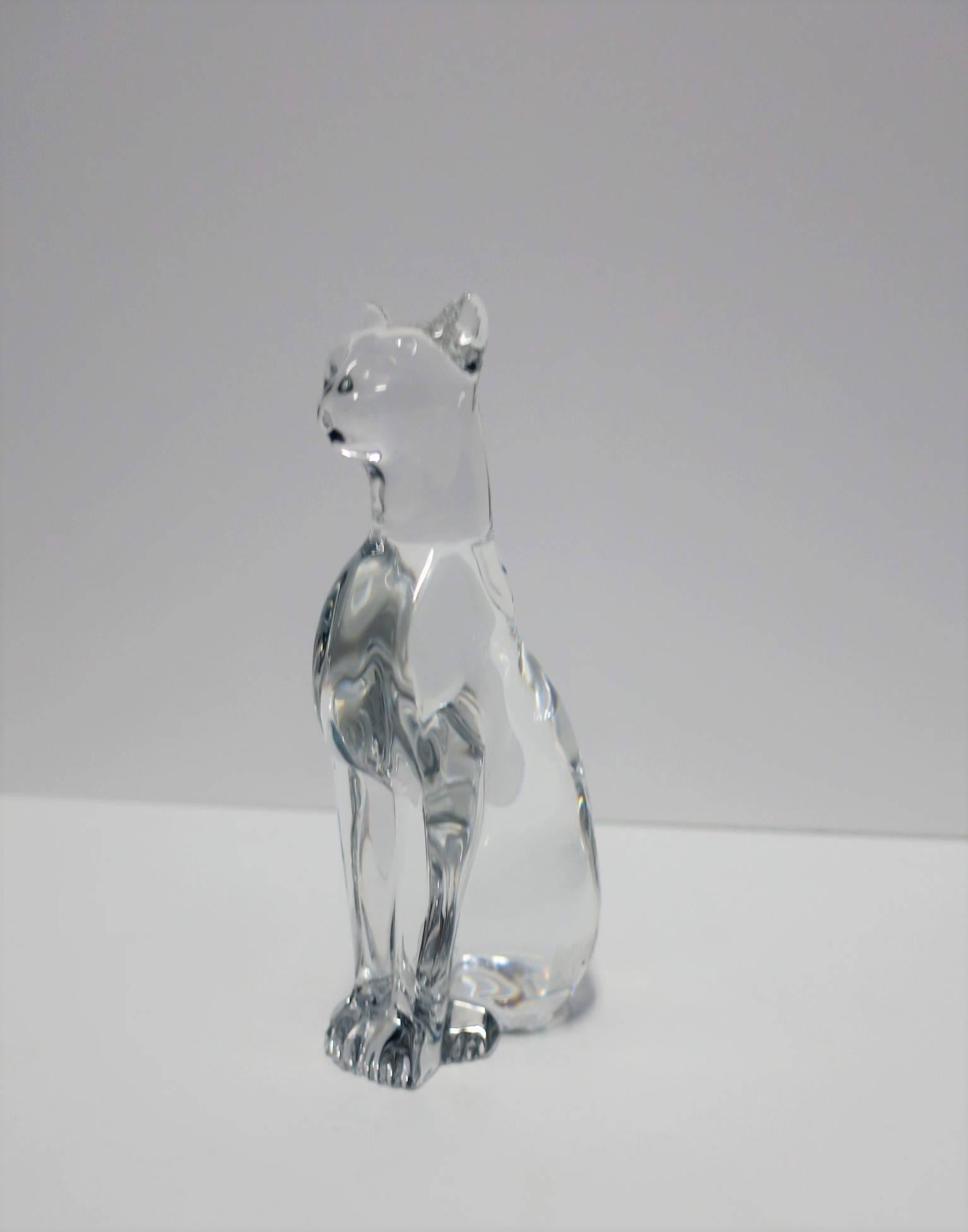 A beautiful Art Deco style Baccarat crystal Cheetah or Panther cat sculpture, made in France. Piece has authentication marker's mark on bottom as show in image #10. Piece is in excellent condition. 

Piece measures: 2 in. W x 2.75 in. D x 6.25