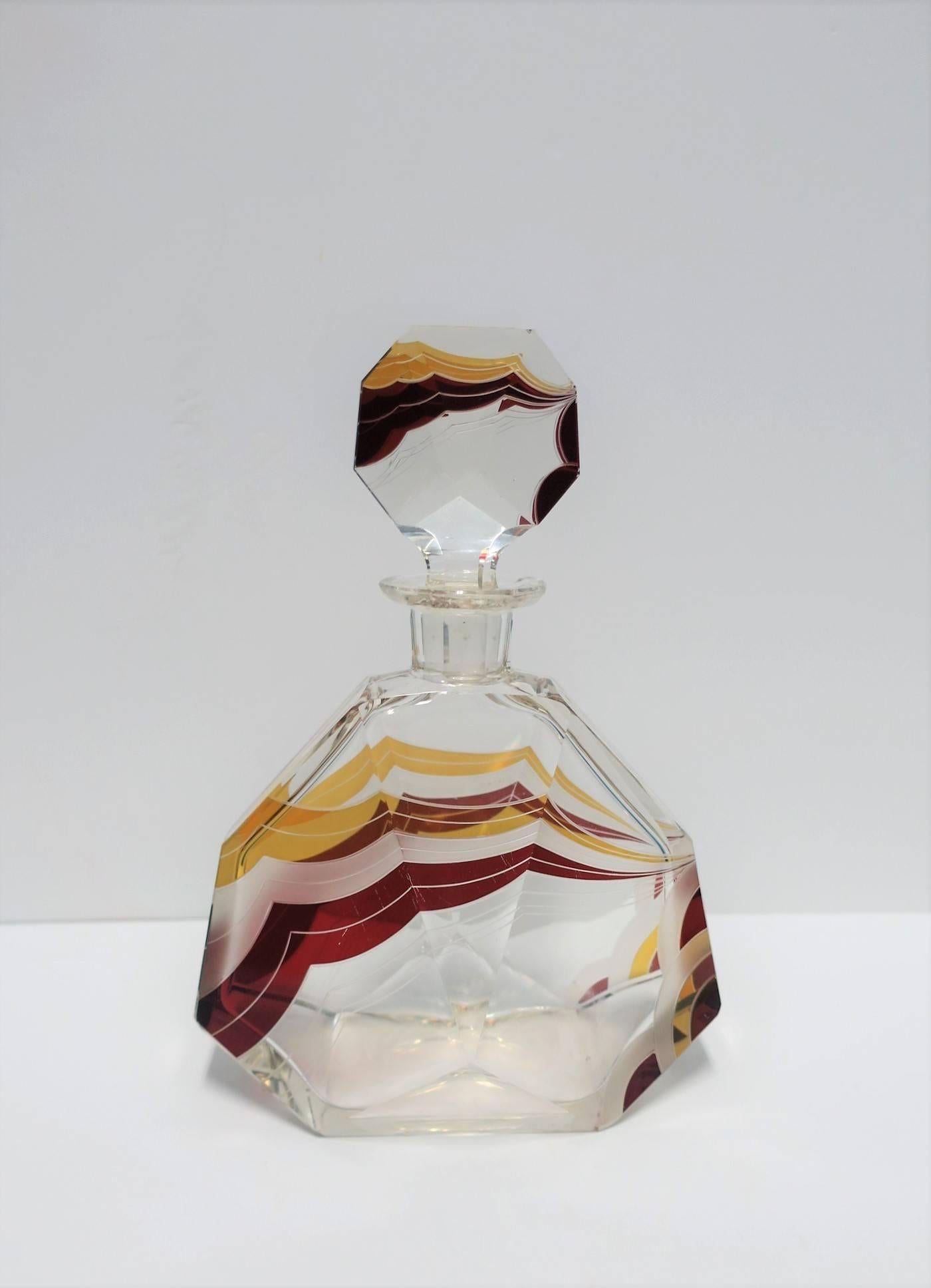 A very beautiful and substantial European Art Deco period crystal decanter by designer Karl Palda, circa 1930s, Czechoslovakia. This beautiful and substantial European designer liquor or spirits decanter has a geometric shape, octagonal topper, red