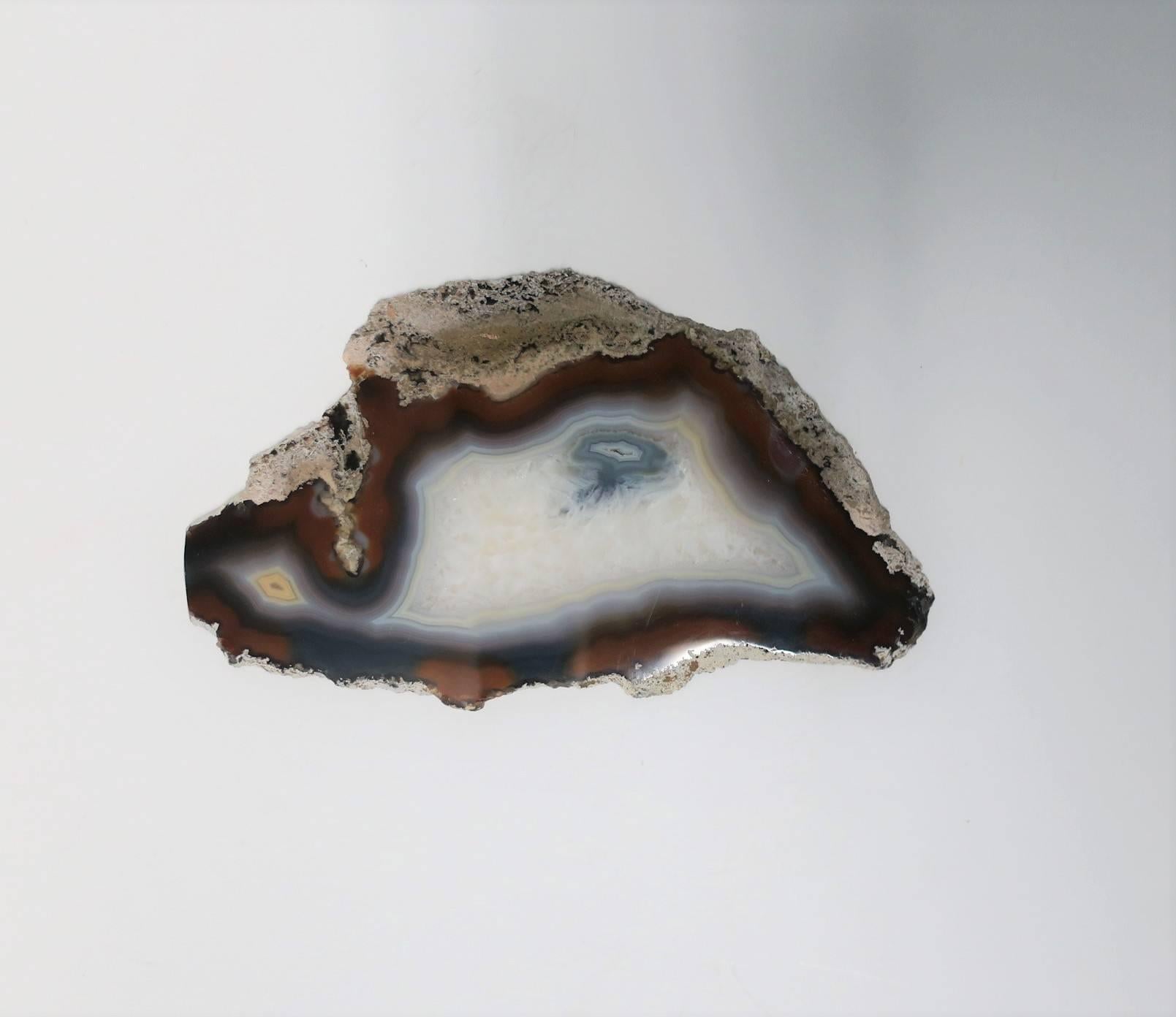 A beautiful blue and white agate onyx decorative object slab or tray. Piece can work well as a standalone decorative object, display piece, or tray to hold small items (jewelry in image #3.) Colors include: white, cream, blue and brown hues. Piece