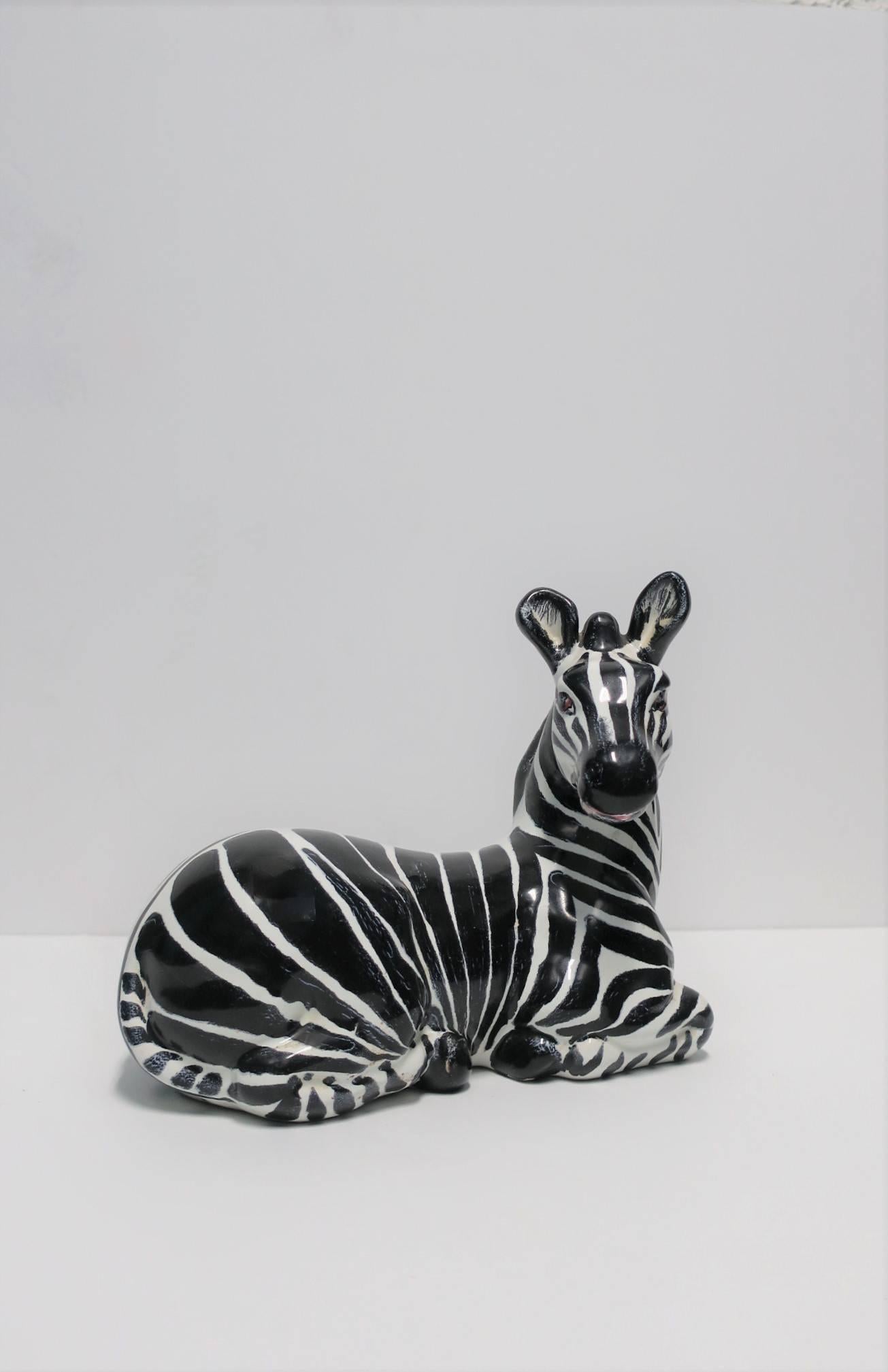A beautiful, striking and relatively large, vintage Italian black and white zebra horse ceramic sculpture in the Art Deco style, circa 1970s, Italy. Marked 'Hand Made Italy' on bottom/underneath as show in images #12 and 13. 

Measures: 4.75