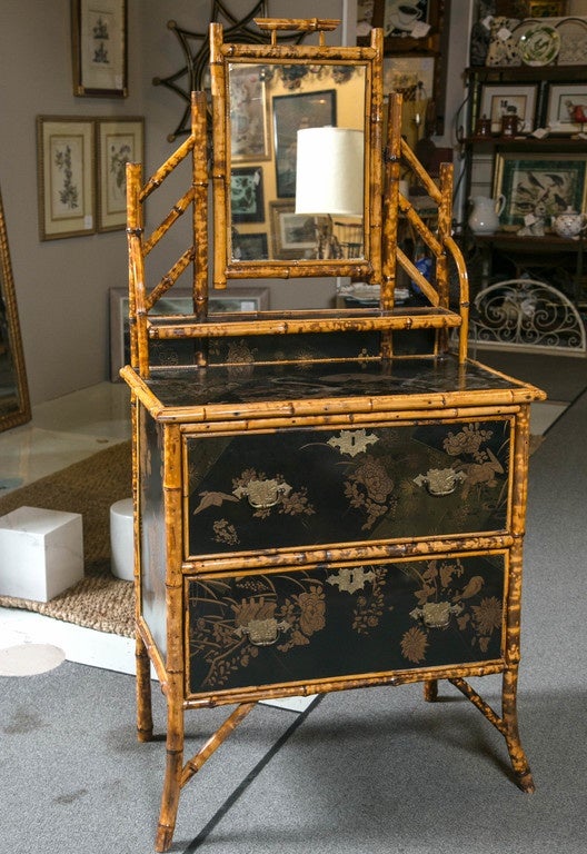19th century English bamboo and black lacquer two-drawer dressing table with adjustable mirror in chinoiserie style.