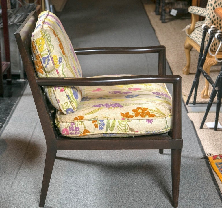 Pair of Mid-Century Baker walnut armchairs with shaped arms, pierced splats with quatrefoil design, removable webbed seat supports and original loose cushions with crewel embroidery.