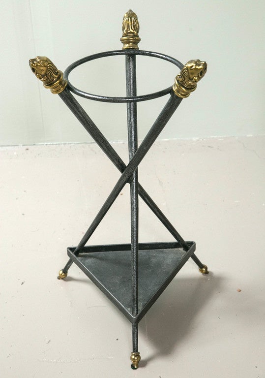 Umbrella/cane stand with lion's head finials and claw feet. Attributed to Maitland-Smith.