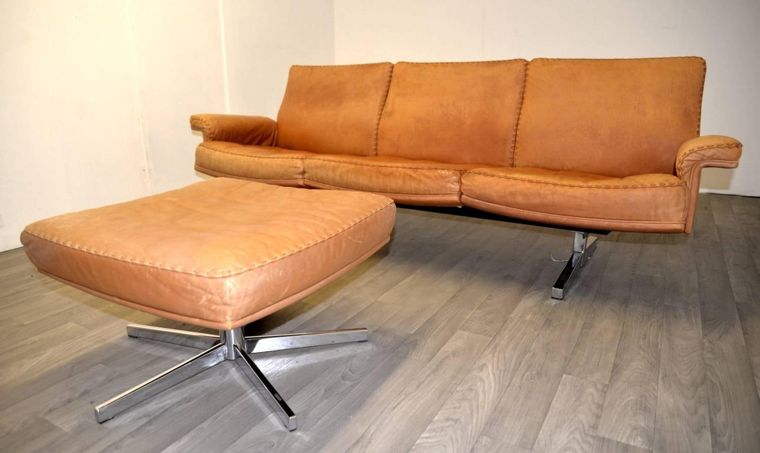 Discounted airfreight for our US and International customers ( from 2 weeks door to door)

The Cambridge Chair Company brings to you a highy desirable vintage de Sede three-seat sofa and matching ottoman. Built in the late 1960`s by de Sede