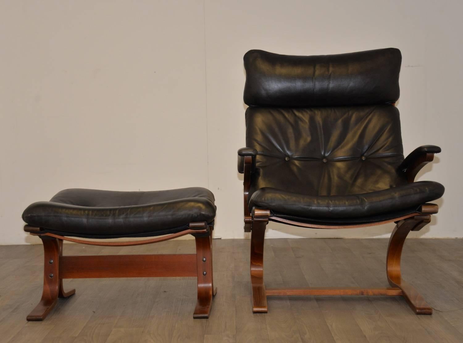 Discounted airfreight for our US and International customers (2 weeks door to door)

Vintage leather armchair in stunning black leather built by Sormani of Italy in 1963. Standing on a rosewood wooden frame and upholstered in stunning soft back