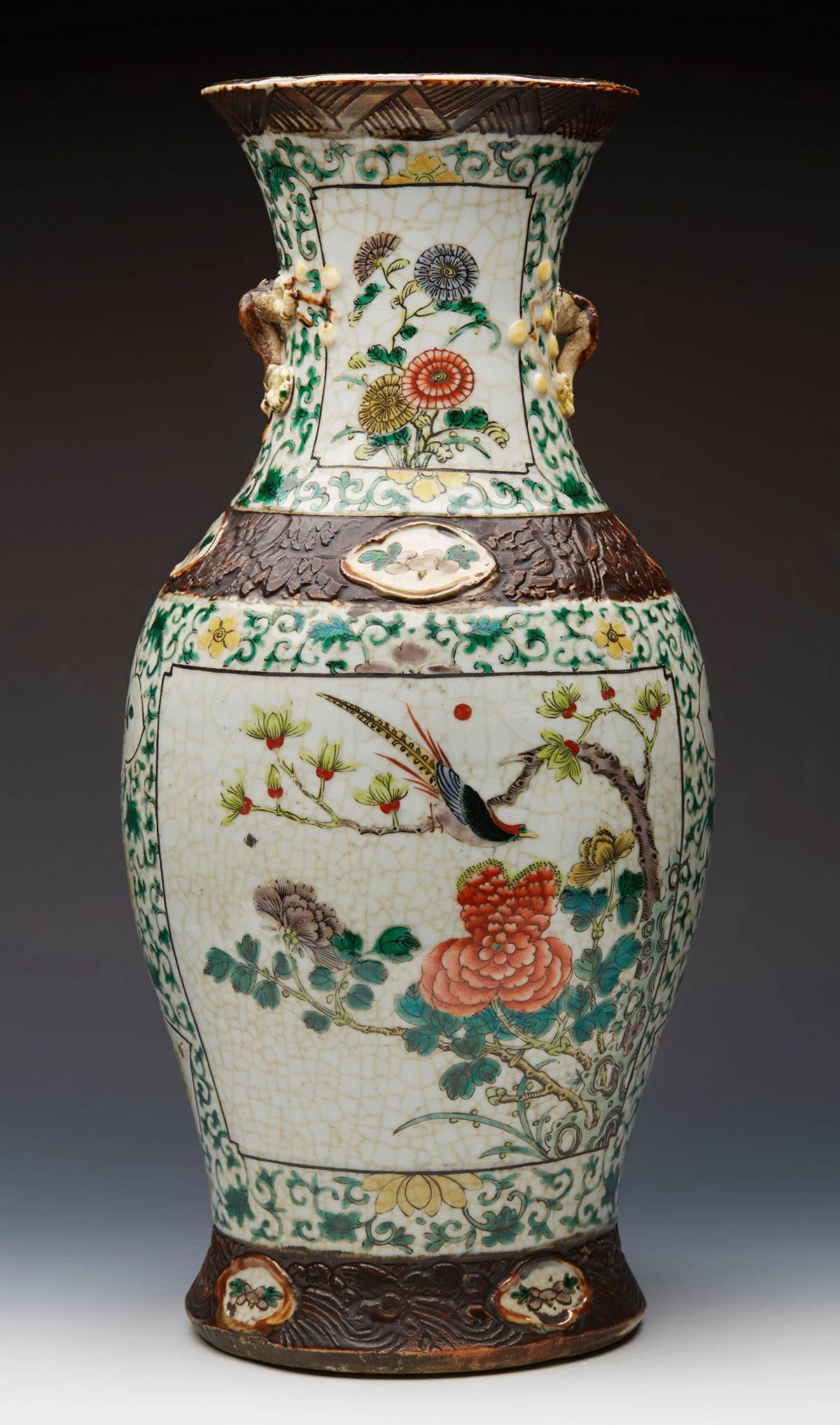 A fine and large antique Chinese hand-painted famille verte cracquel ware vase of baluster shape with moulded brown glazed borders. The body of the vase finely hand-painted with panels with exotic birds set amidst flowering prunus and other shrubs
