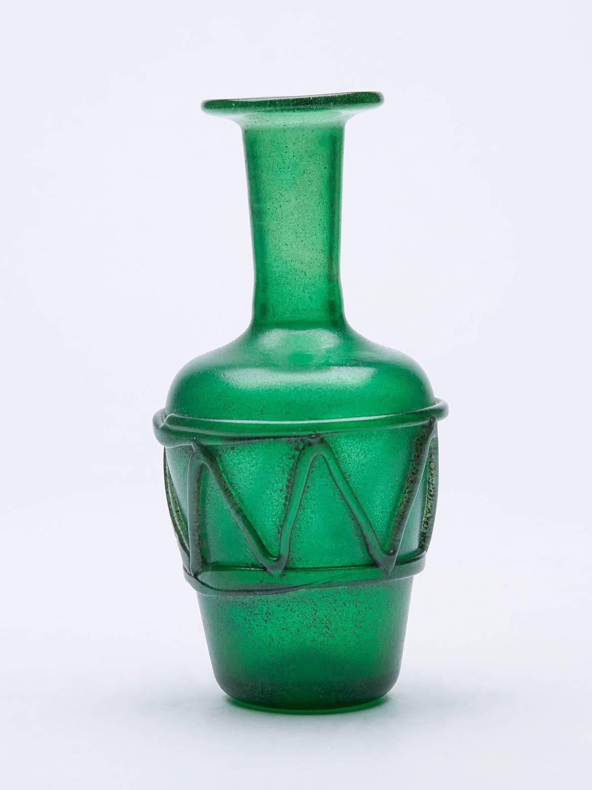 A stunning Italian Mid-Century handblown Murano glass vase in muted tones of green using the Scavo technique and hand applied with trailed patterned detail. Attributed to Seguso the vase has recessed rough pontil mark and is not