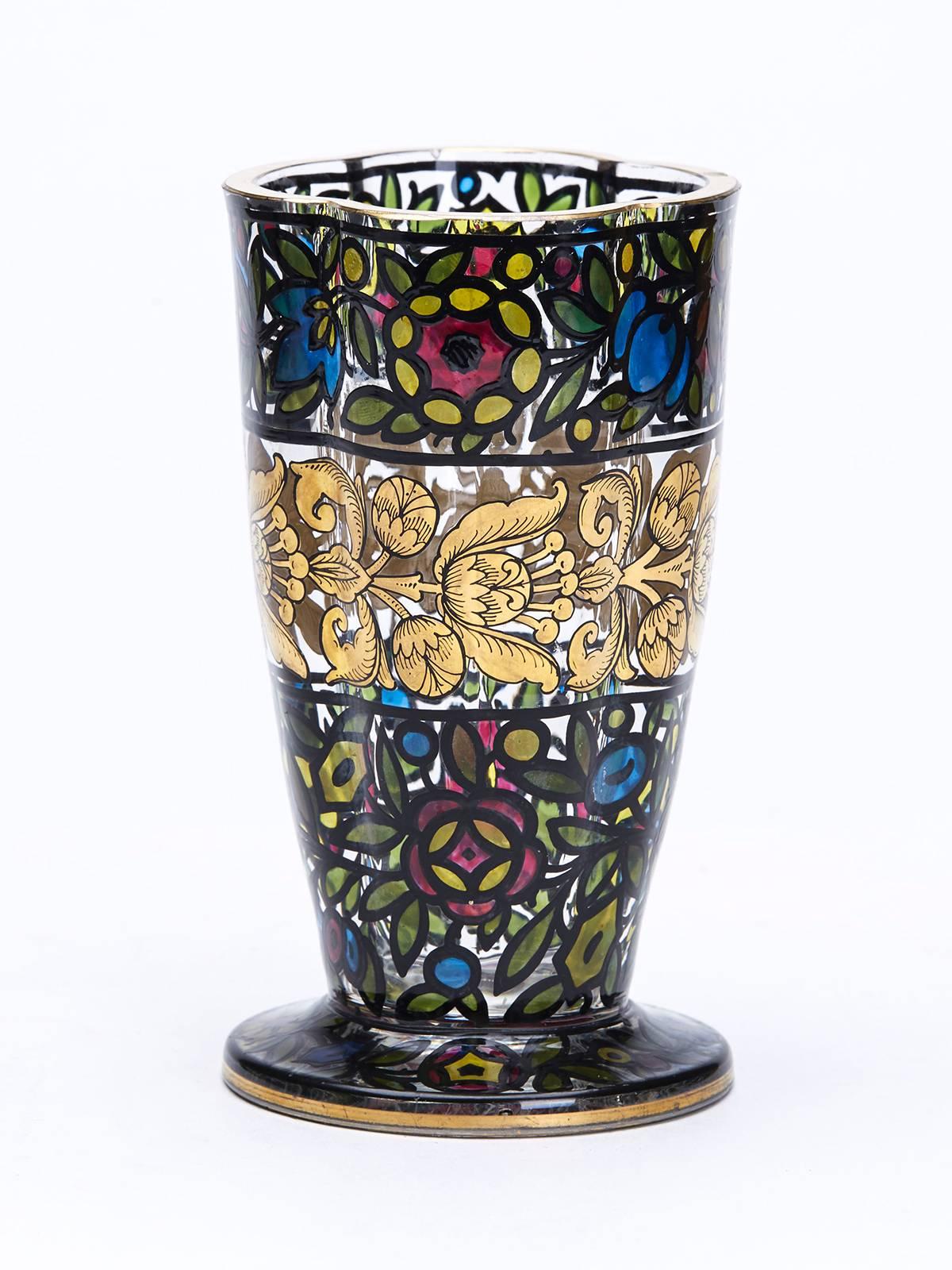 A superb Art Nouveau Bohemian art glass vase by Julius Mulhaus & Co, Haida. The thickly made shaped rounded glass vase is decorated in a stained glass window style with floral designs picked our in translucent colors within a black outline with an