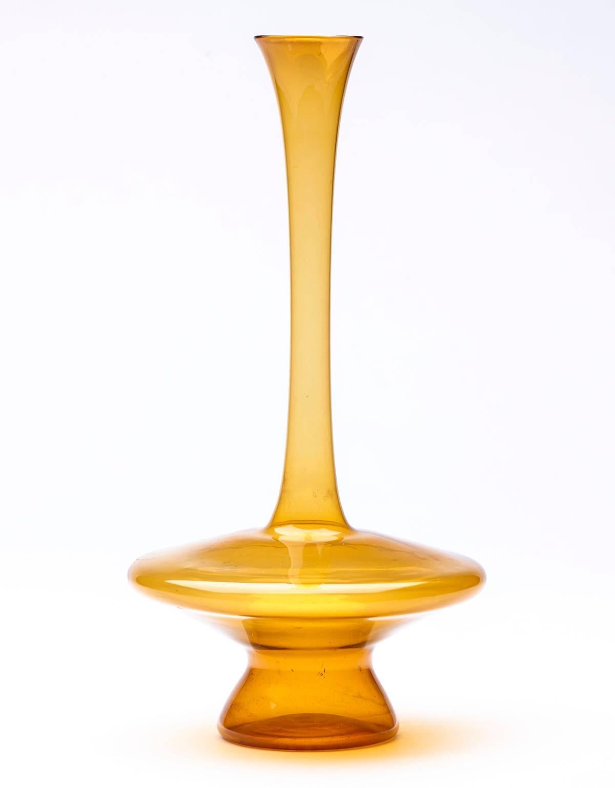 A stunning vintage Murano Soffiati (light blown) solifleur amber glass vase with a squat rounded body on a hollow blown shaped foot with a tall slender neck with a small trumpet shaped top. The vase is not marked. 

These light blown or Soffiati