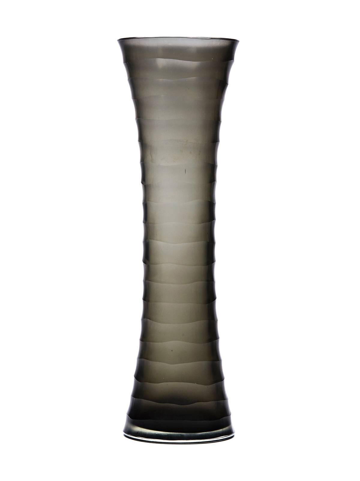 A stunning and unusual Italian Murano art glass battuto vase of tall narrow waisted shape in grey smoked glass with a ridge cut or battuto design in a frosted finish. The vase is not marked but reminiscent of the battuto styles being produced by