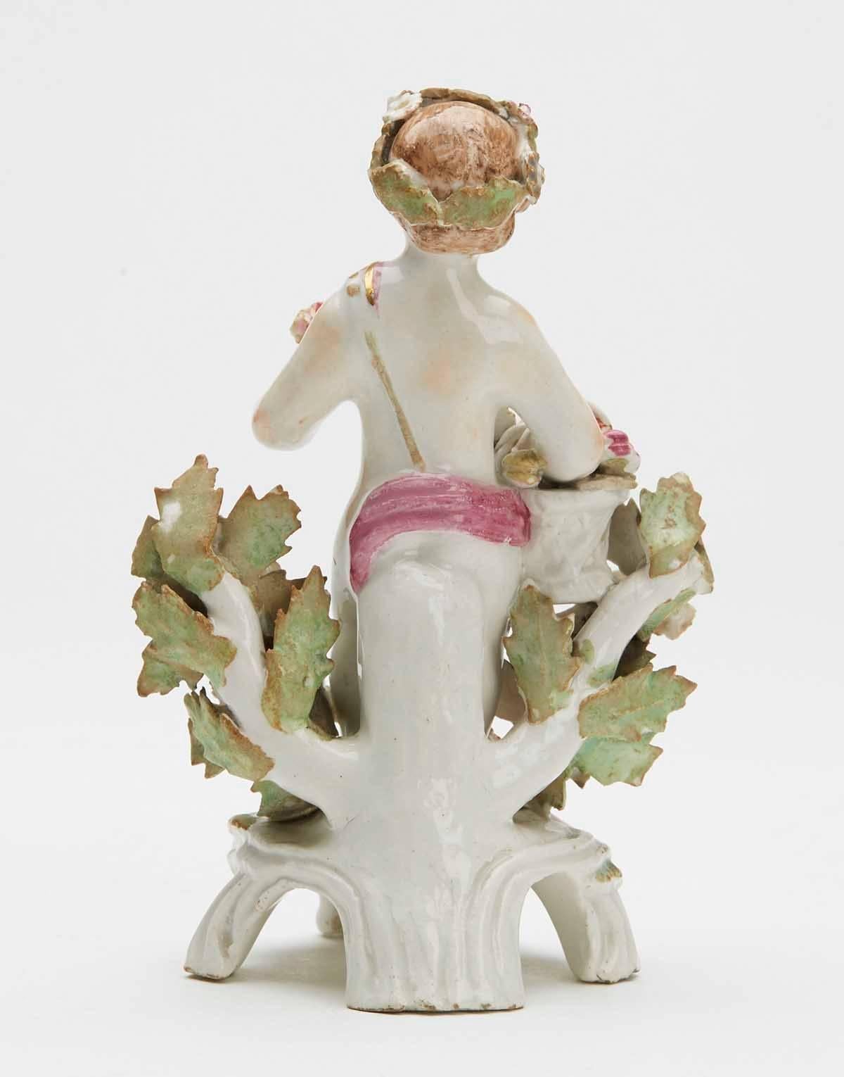 English Bow Figure of a Putti Holding a Basket of Fruit, circa 1765