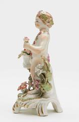 Bow Figure of a Putti Holding a Basket of Fruit, circa 1765