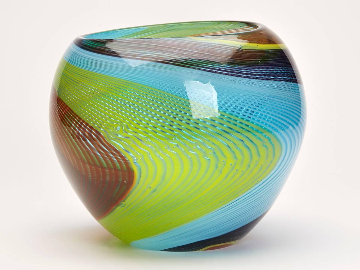 A stunning vintage Italian Murano Stefano Toso art glass vase of goldfish bowl shape with coloured ribbon trailed panels within a tinted glass body. The rounded handblown glass vase has some typical bubbling and other making inclusions in the body