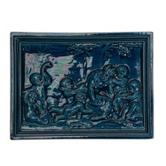 Pair of Burmantofts Faience Bacchanalian Blue Tiles