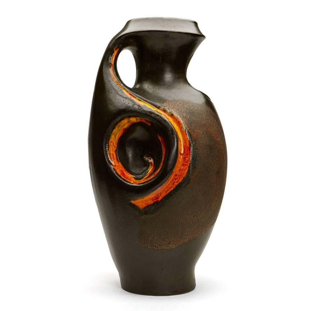 A stunning set of three vintage, graduated Walter Gerhards West German Fat Lava handled vases decorated in bright flame orange glazes with matted lava glazes on a black pewter ground. The vases range in height between 25 cm, 37 cm and 53 cm and each