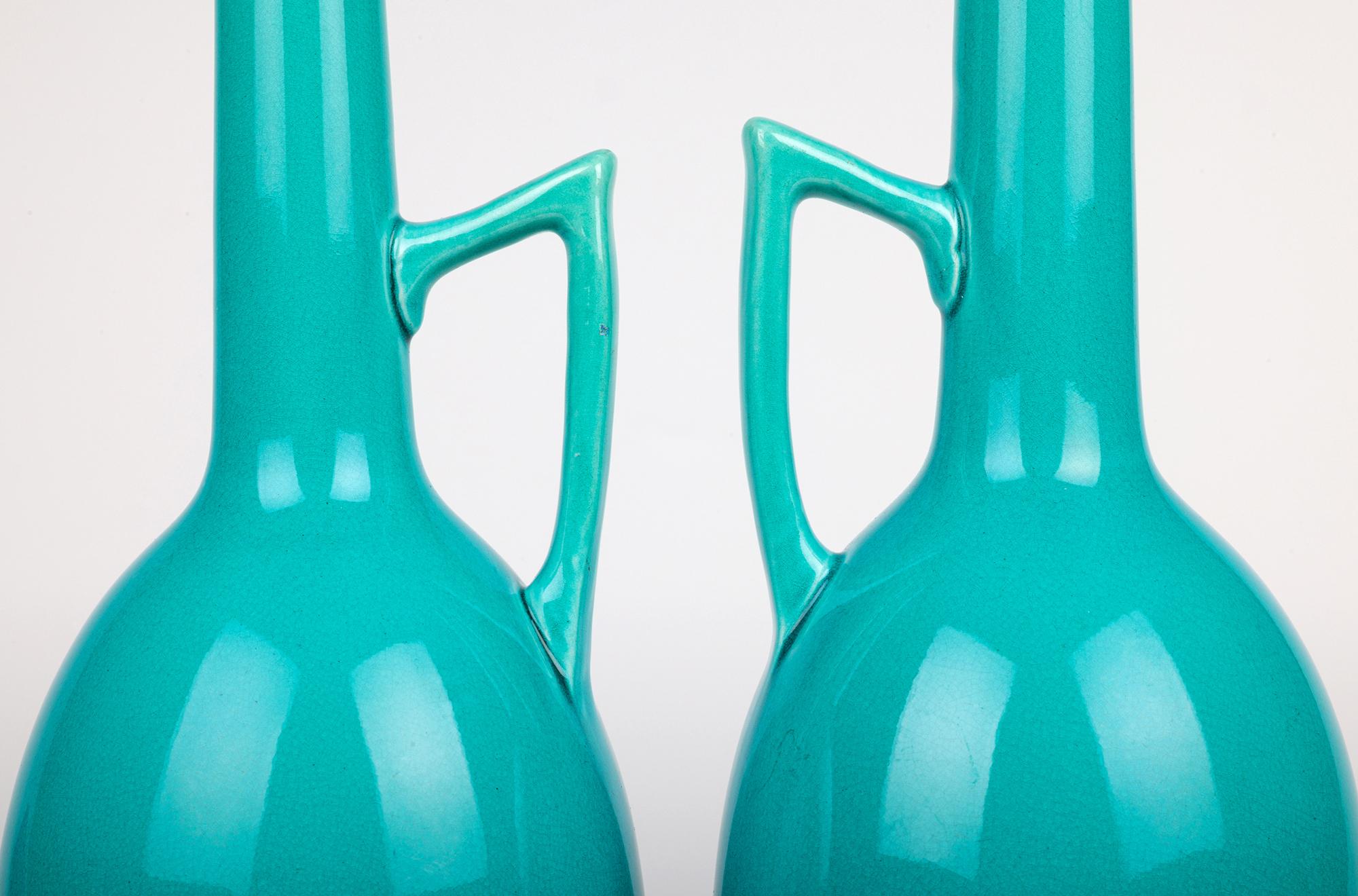 British Burmantofts Pair Turquoise Glazed Ewer Shaped Art Pottery Vases For Sale