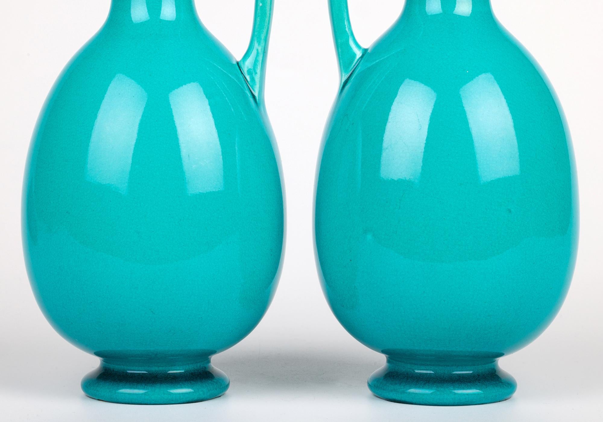 Arts and Crafts Burmantofts Pair Turquoise Glazed Ewer Shaped Art Pottery Vases For Sale