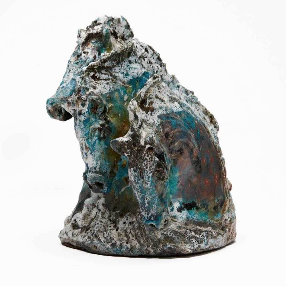 A stunning vintage Studio Pottery sculpture by Jane Malvisi of three horse heads in raku molten glazed in turquoise and white with black 'smoked' elements with other colours emerging with crazing lines within the glaze. 

Welsh-born Jane mainly