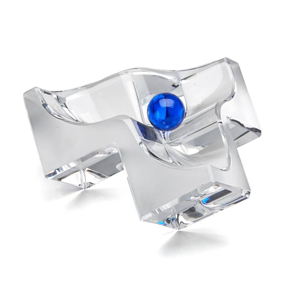 A stunning French Daum crystal glass sculptural bowl formed as three joined cubes with three corner points forming the feet with the upper section hollowed out with a free sitting large blue glass marble supported in the centre of the bowl. The