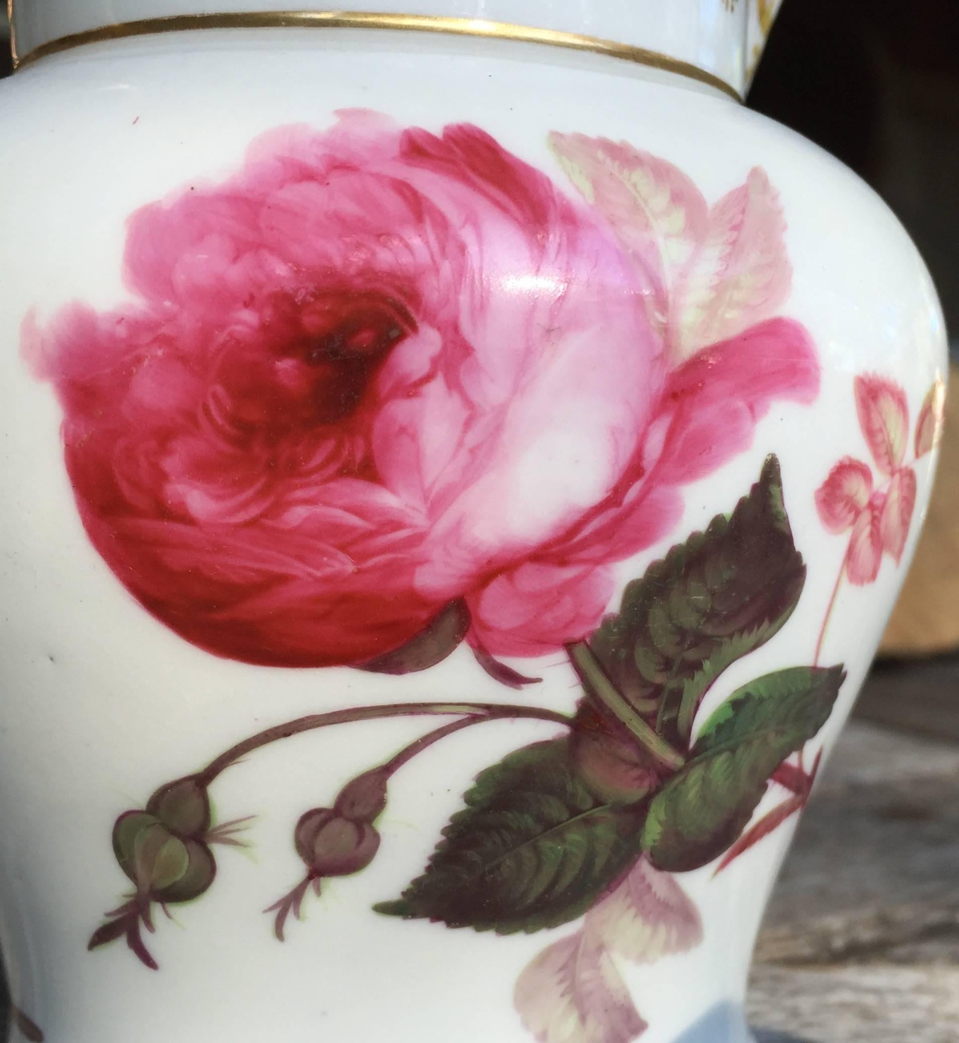 This Beautyful Paris Porcelain Hand painted Pitcher with elaborate Roses and Tulips amongst others could not be better in execution. 
The hand-painted Goldwork continues on the inside of the snout of the Pitcher.
Made ca 1820 in France, Paris.