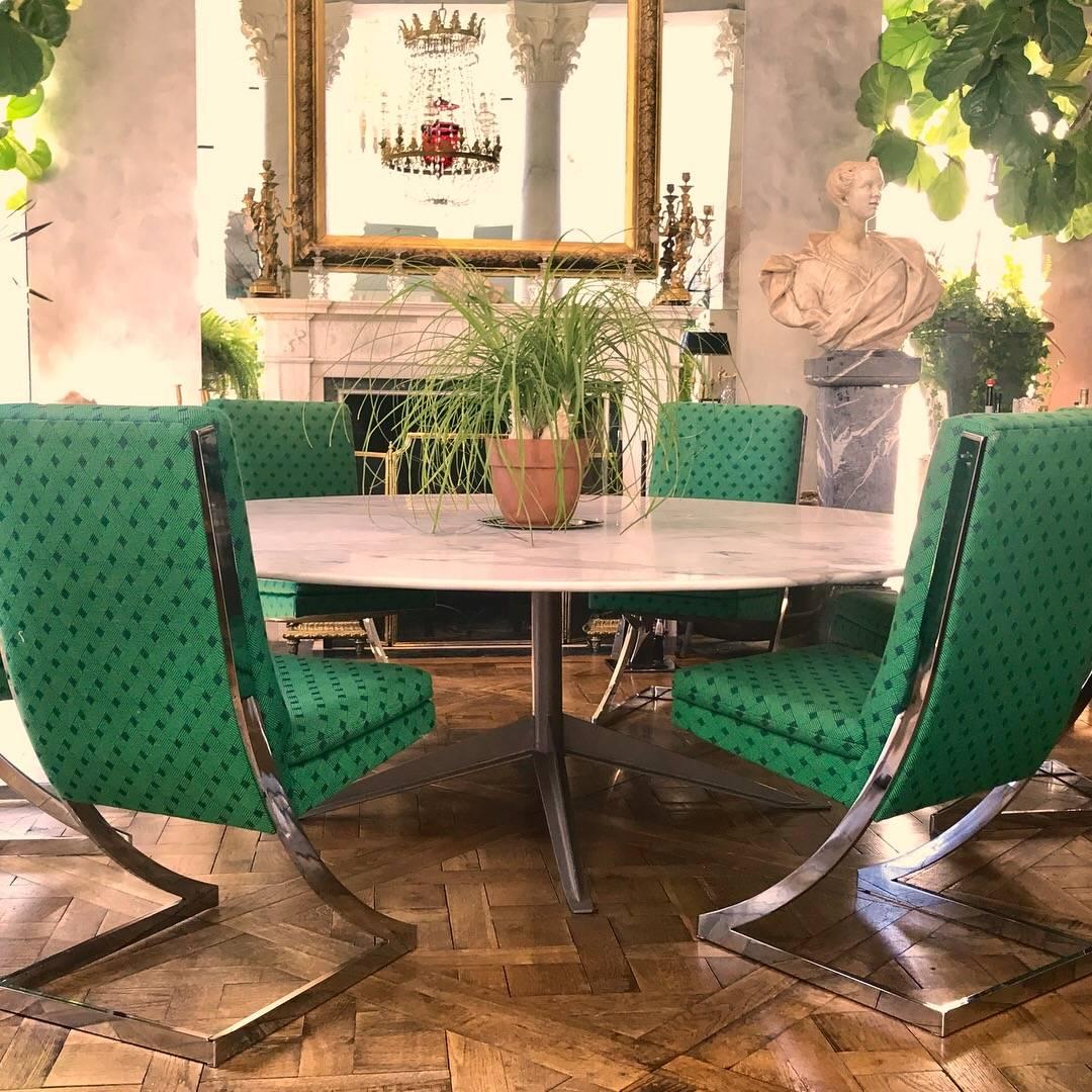 Gorgeous set of 12 Milo Baughman style cantilevered chrome framed dining chairs made for the Design Institute America. Six are covered in their original vibrant green fabric.
