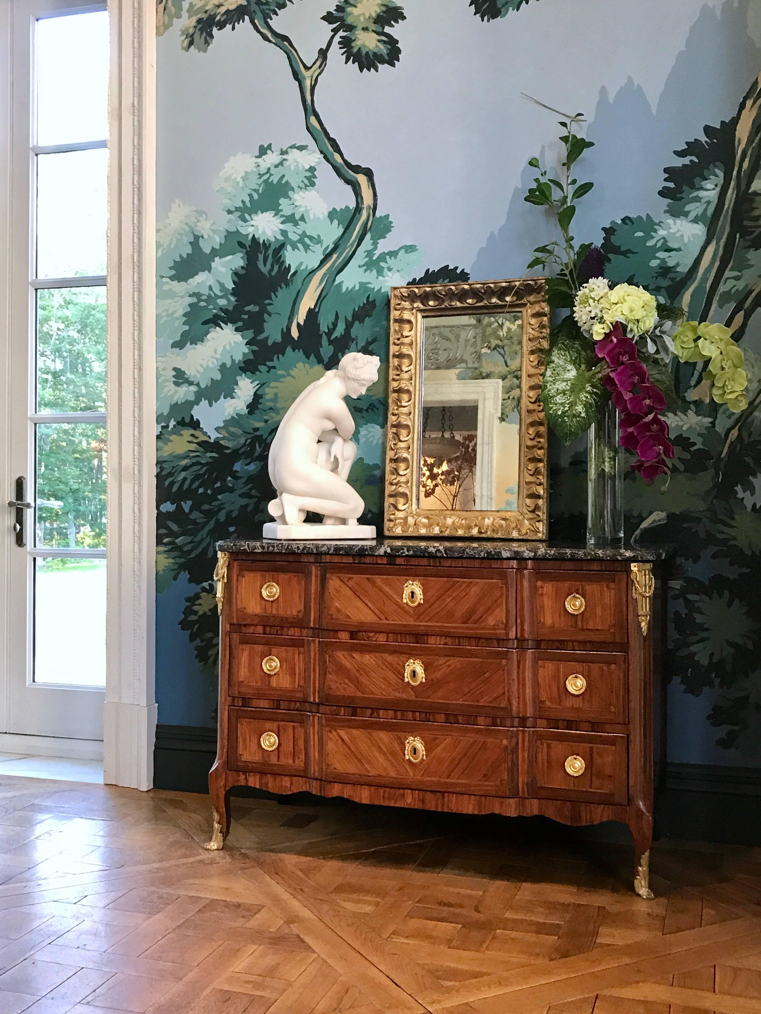 This exquisite Louis the XV/XVI Period transitional Kingwood three over two-drawer commode has an original grey marble top and retains all its original ormolu mounts.
The short cabriole legs terminate in sabots.
Made in France circa 1770.