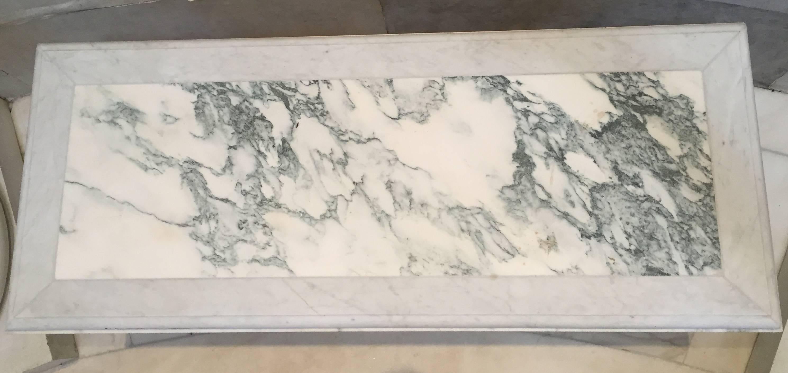 This is one of four marble benches. The bases are 19th century, the blue cheese and Carrara marble-top is from a later date, but perfectly befitting and has aged appropriately.
The bases are white Carrara marble.