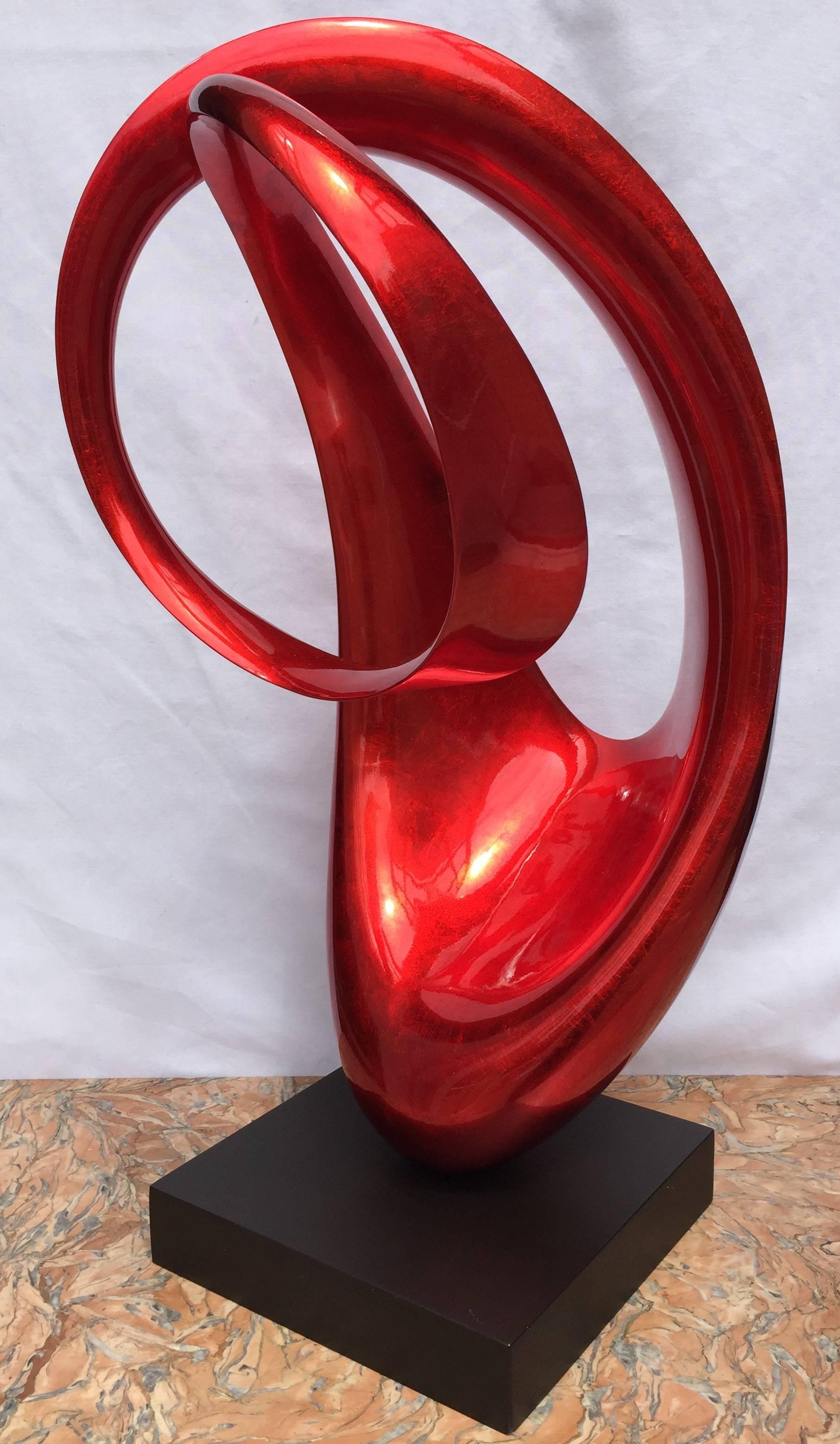 This Modern elyptical sculptures in metallic red is eye catching from every angle. 
Made of fiber wood.
 Presumably in the line of 