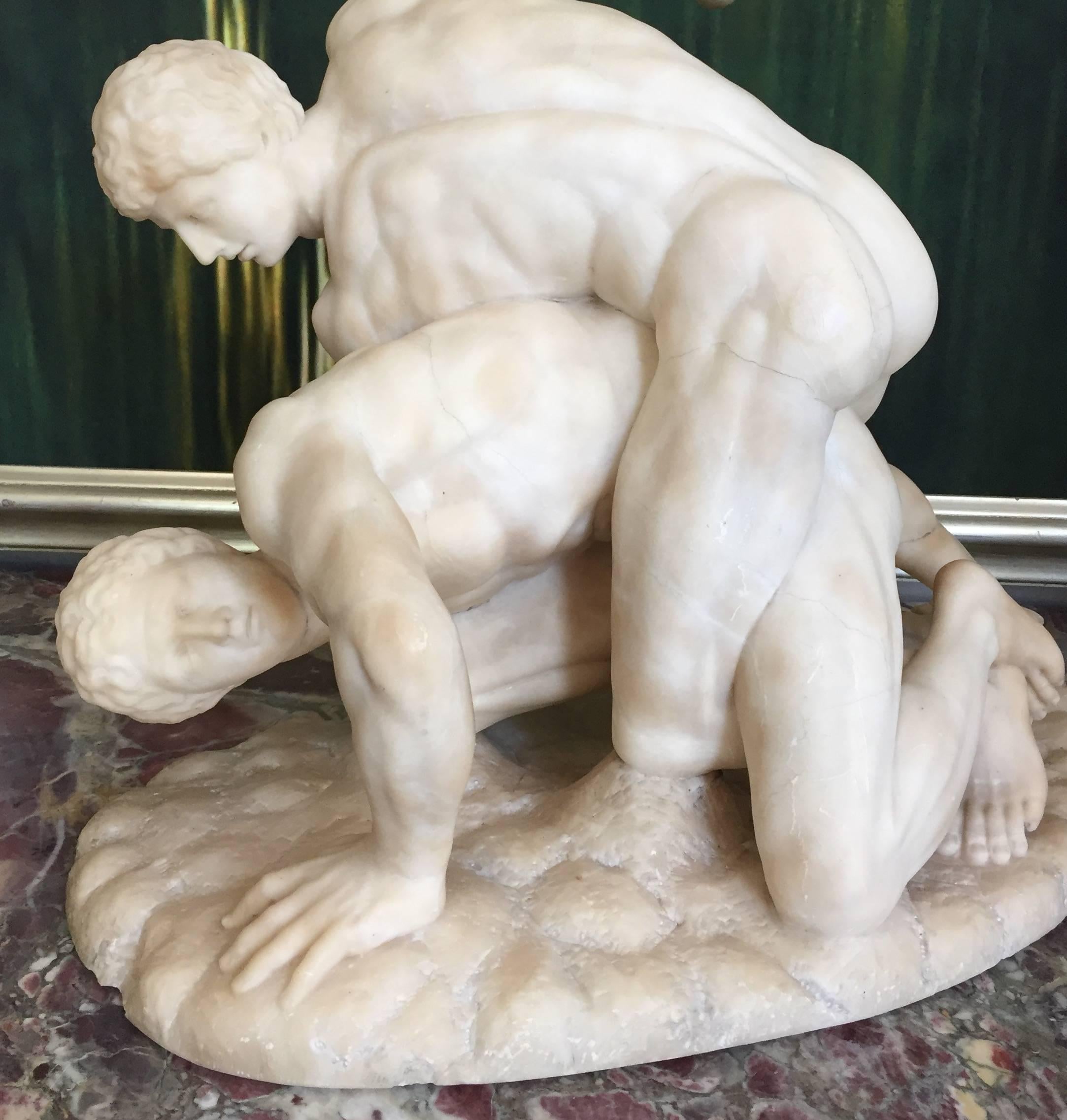 This Exquisitly carved Alabaster Sculpture of the Uffizi Wrestlers, also called 
