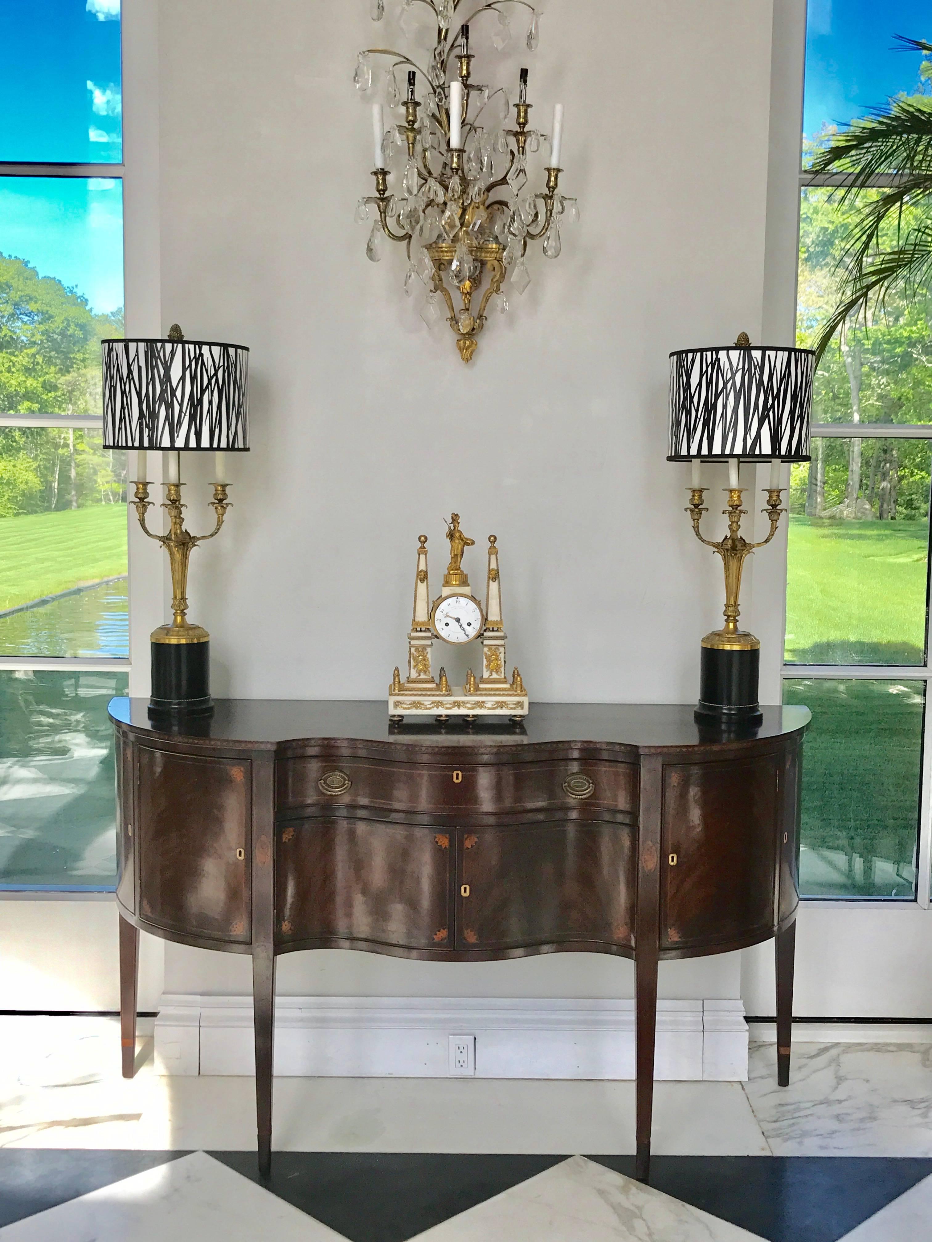 This magnificent Louis XVI period overmantel cock was made by Charles Bertrand in Paris, circa 1790. It is constructed like an architectural monument consisting of two Obelisks on top of Plinths highly decorated in ormolu mounts of Trophies.