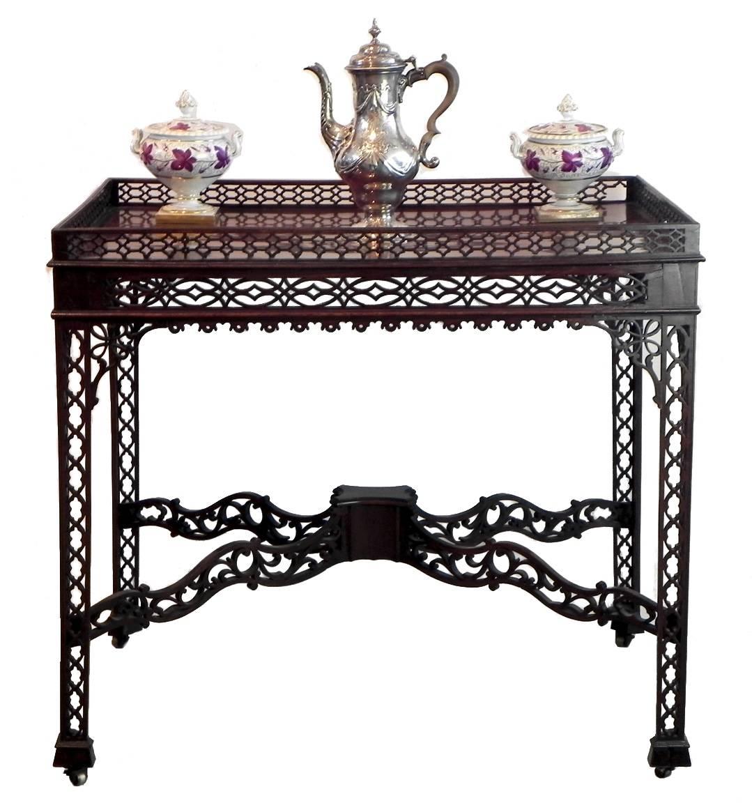 This exquisite Mahogany George III Chinese Chippendale Tea Table was the equivalent of a modern day coffee table. 
The delicate fretwork throughout is all original and the top is made of one piece of Flame Mahogany. The table stands on it's original
