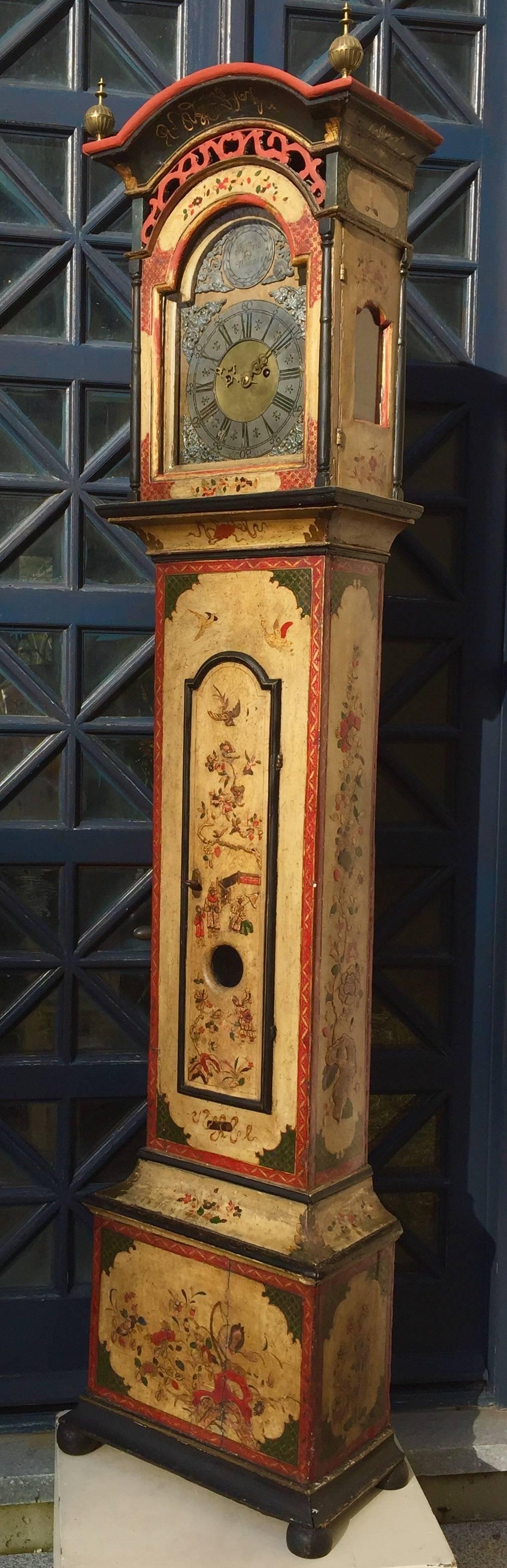 18th Century Chinoiserie Painted Grandfather Clock by Fredric Weleher. This absolutely charming grandfather clock was crafted in Denmark by Fredric Weleher in the Chinese Chippendale style, circa 1780.
The background is aged white, which has turned