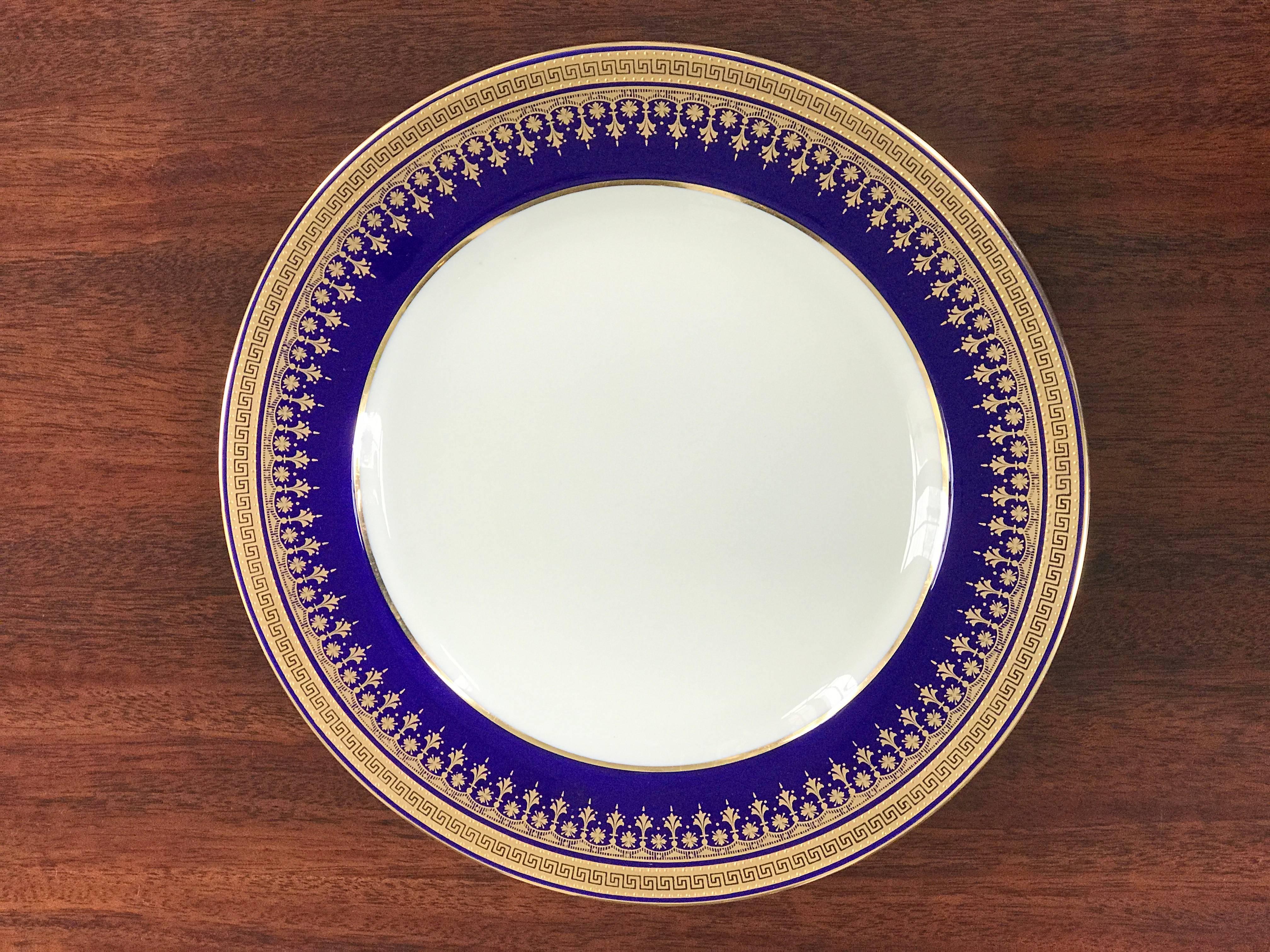 This gorgeous set of 12 Copeland Plates was commissioned for Davis Collamore & Co 5th Avenue New York . These dinner plates are in mint condition! 
The 3 dimensional raised gold on a cobalt blue border is lined with the ancient Greek Key