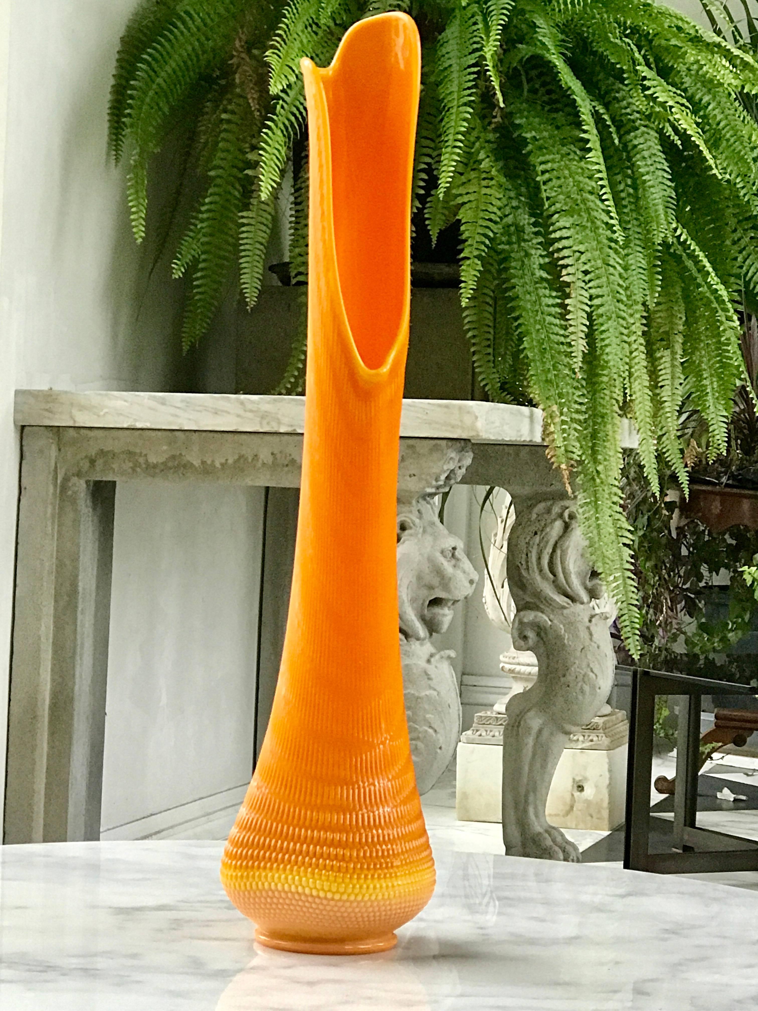 Beautiful and rare monumental handblown Ventetian style glass vase.
The happy and bright orange color and the unique opening of melted glass makes this vase so special.
Made in the US
circa 1972.
 
