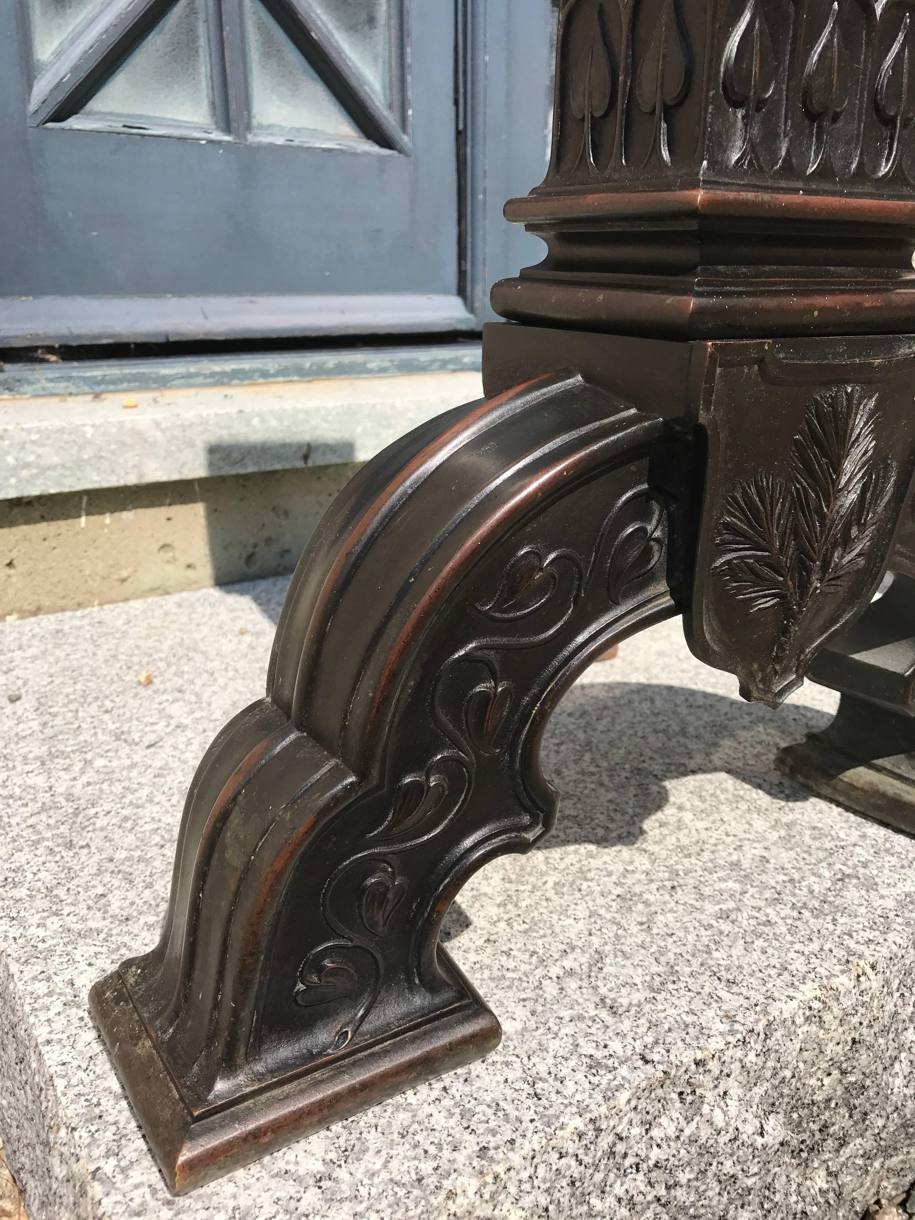 A magnificent pair of large-scale Arts & Crafts period solid bronze andirons.
They maintain their original Patina. The fine craftsmanship and original Design suggests that they were commissioned for a Grand Estate. They weigh about 30 pounds each
