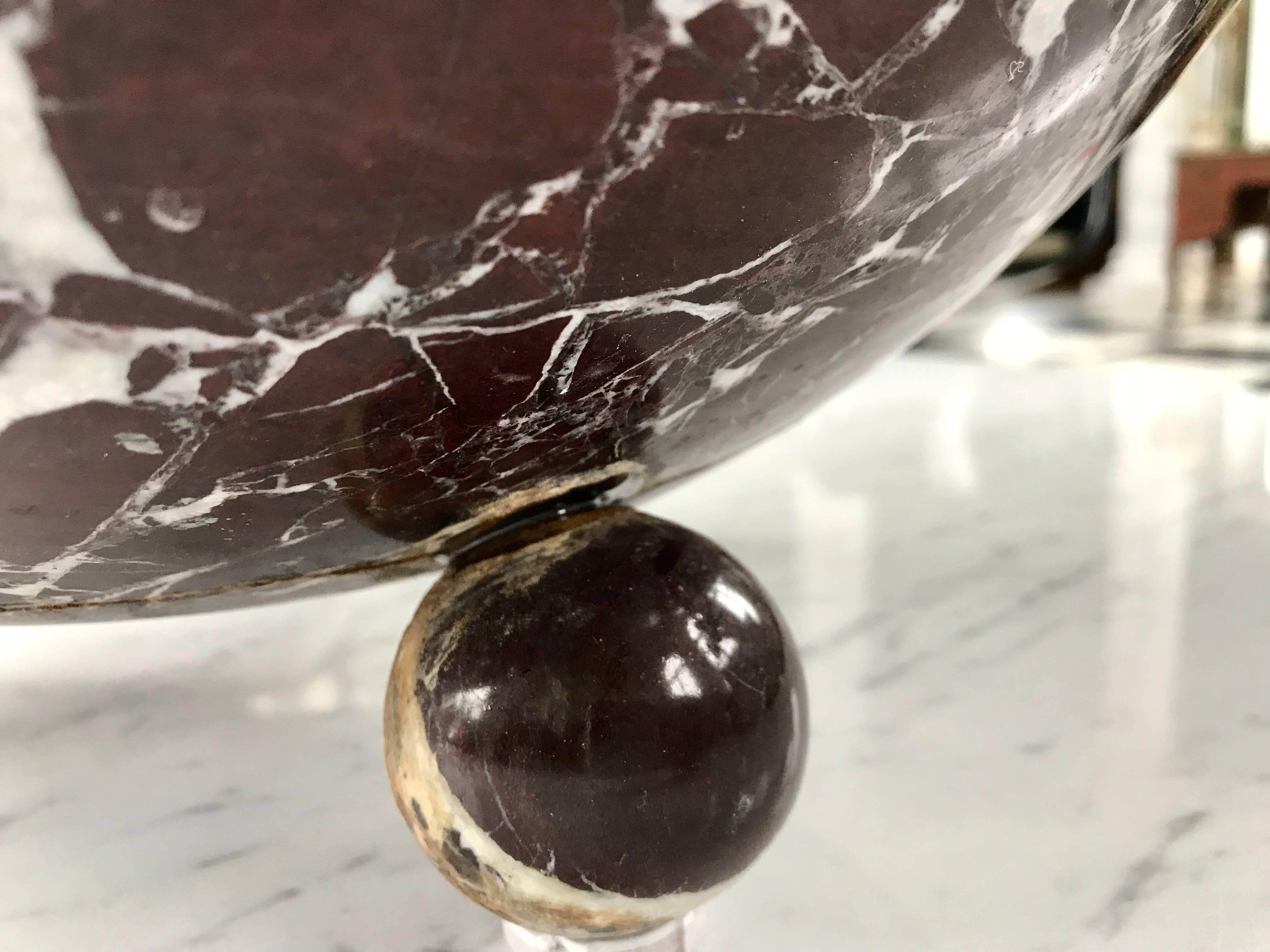 This gorgeous centrepiece bowl is carved out of the rare Rossa Levanto Marble. The simple Art Deco style bowl is supported by three spheres. We have two of them in case you need a pair.